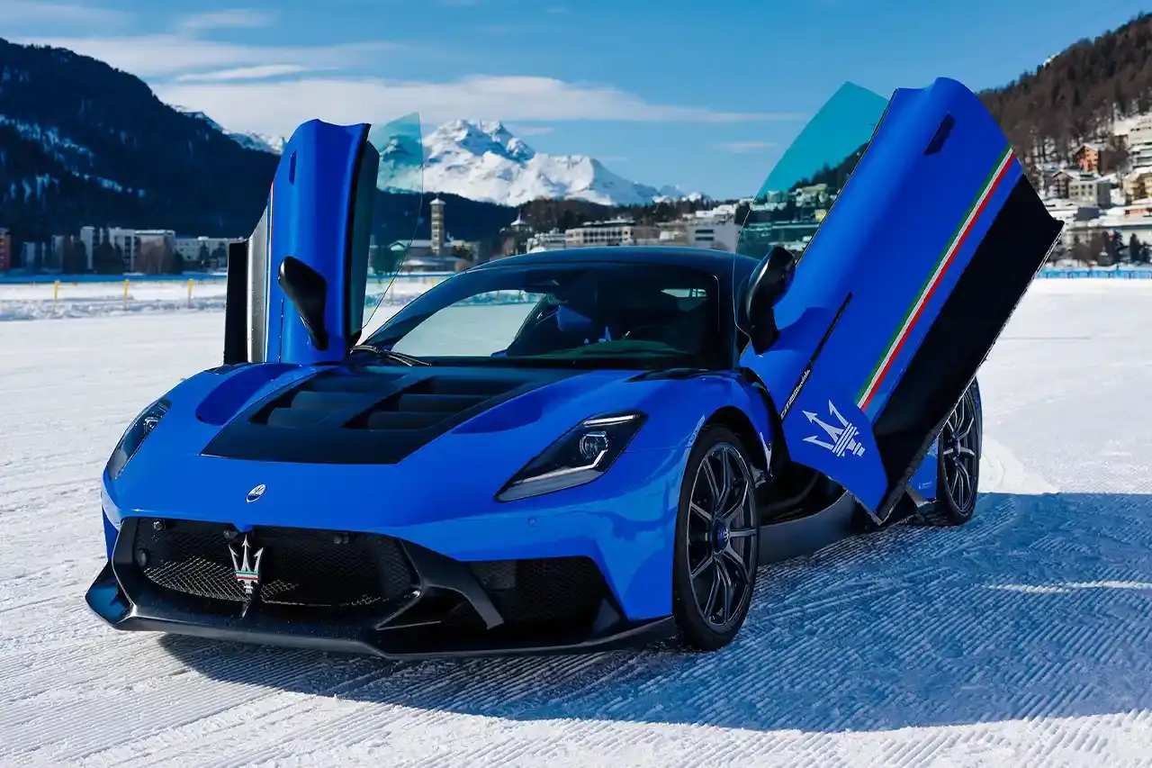 Maserati 2024 Maserati GranCabrio convertible in profile view, parked on snow with Swiss Alps in background at St. Moritz (image 7 of 9)