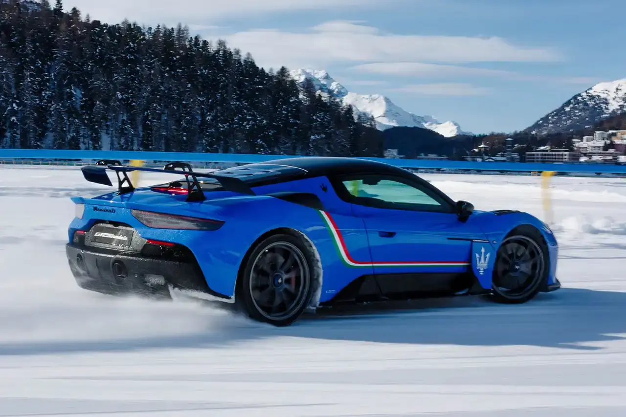 Maserati 2024 Maserati GranCabrio convertible in profile view, parked on snow with Swiss Alps in background at St. Moritz (image 8 of 9)