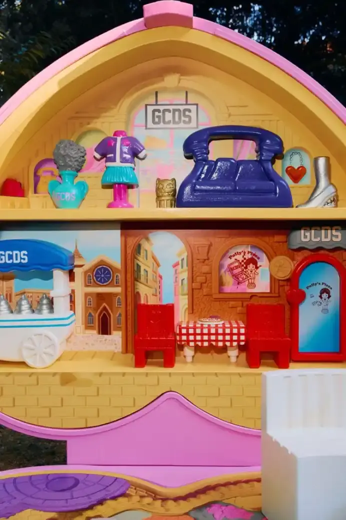 MATTEL PARTNERS WITH GCDS FOR POLLY POCKET COLLECTION Image about a business collaboration between toy company Mattel and Italian fashion house GCDS to create a limited-edition Polly Pocket collection. The article includes details about product availability, previous partnerships between the brands, and background information about both companies. Contains no images, videos, or interactive elements requiring additional accessibility considerations. (image 5 of 15)