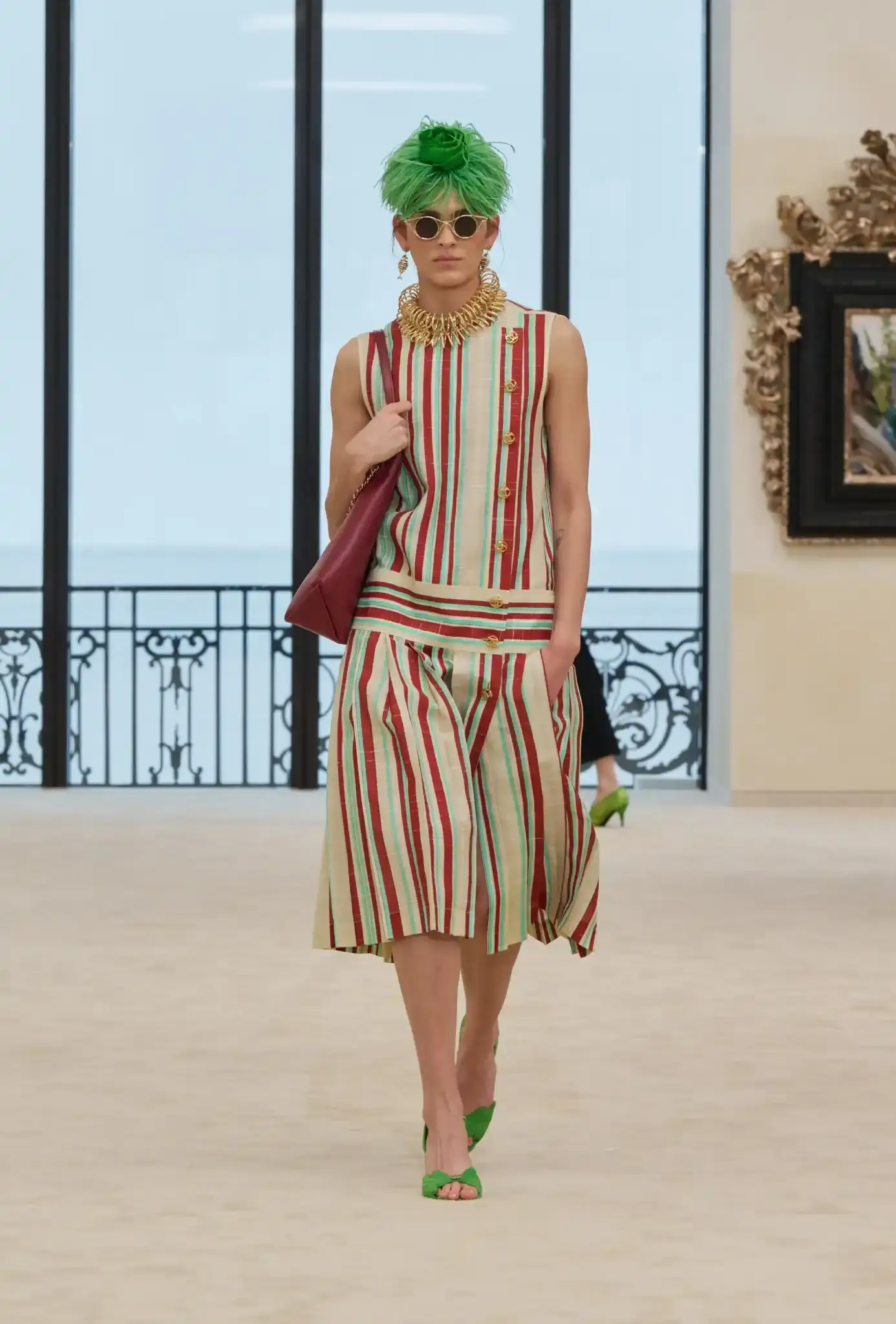 MATTHIEU BLAZY PRESENTS CHANEL CRUISE IN BIARRITZ an image describing the Chanel Cruise collection shown in Biarritz by designer Matthieu Blazy. The article details clothing pieces and front row guests. (image 10 of 10)