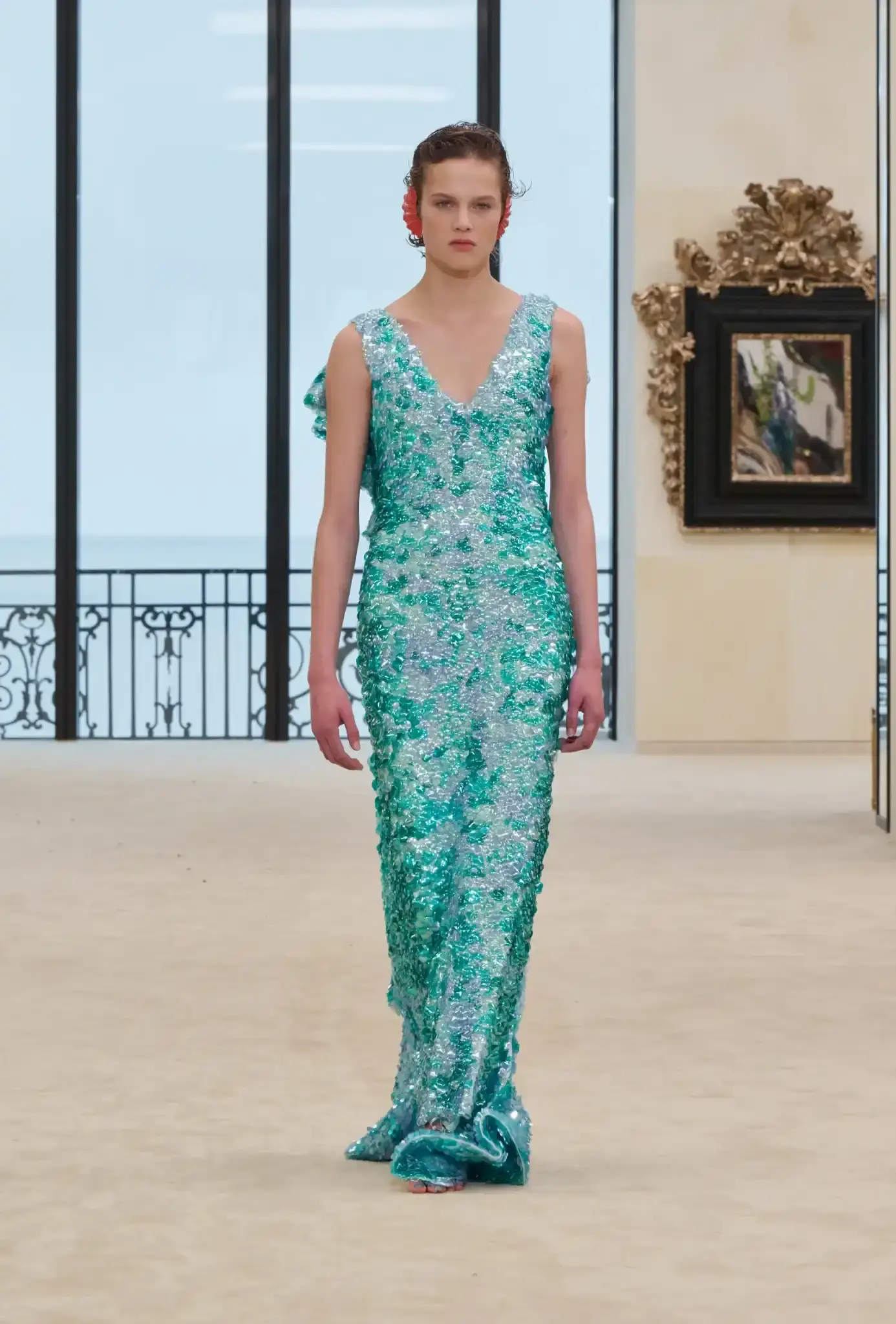 MATTHIEU BLAZY PRESENTS CHANEL CRUISE IN BIARRITZ an image describing the Chanel Cruise collection shown in Biarritz by designer Matthieu Blazy. The article details clothing pieces and front row guests. (image 9 of 10)