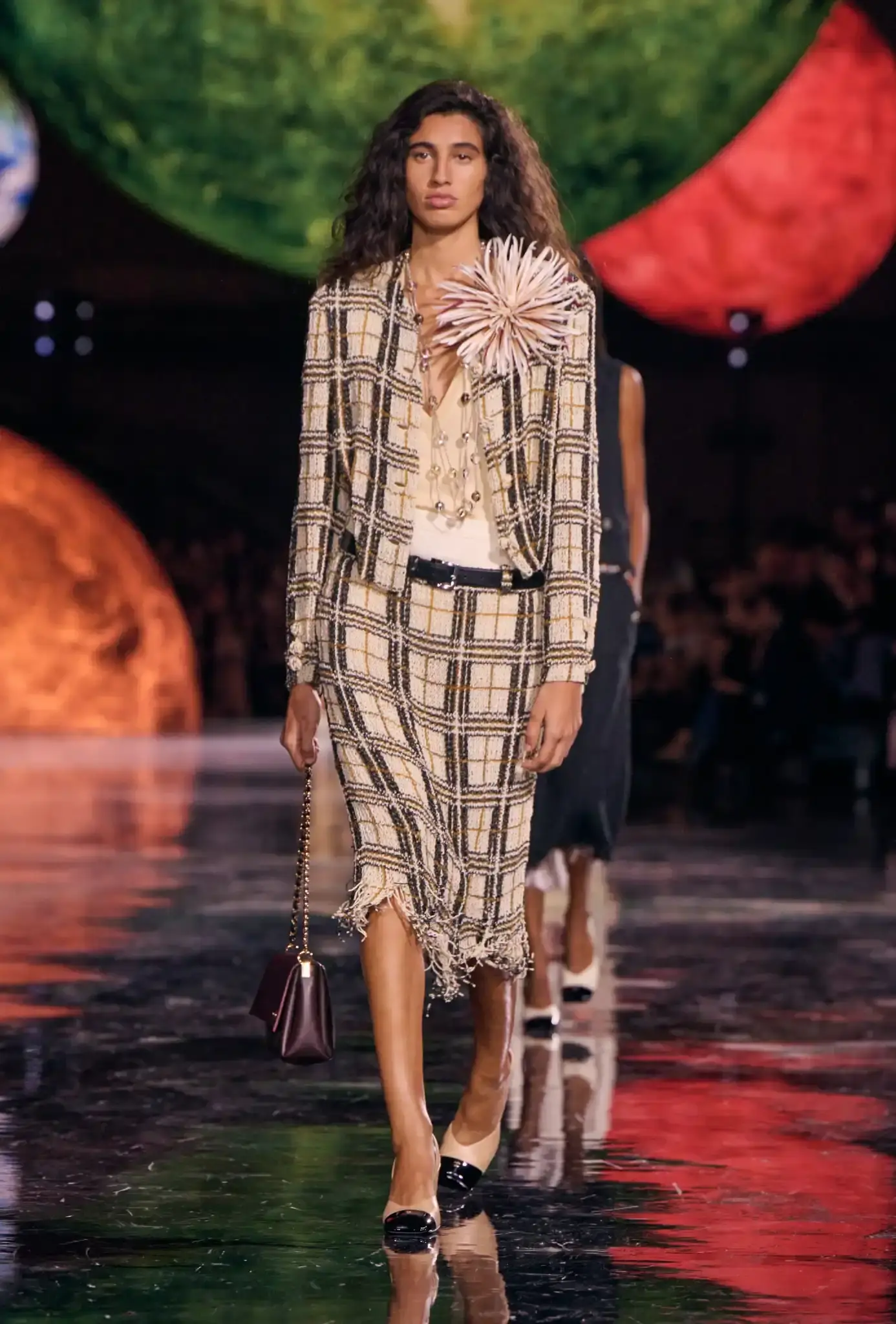 MATTHIEU BLAZY TAKES OVER CHANEL Article examines Matthieu Blazy's inaugural Chanel collection, exploring how the designer balanced the house codes with his personal aesthetic vision through three themed chapters. (image 6 of 11)