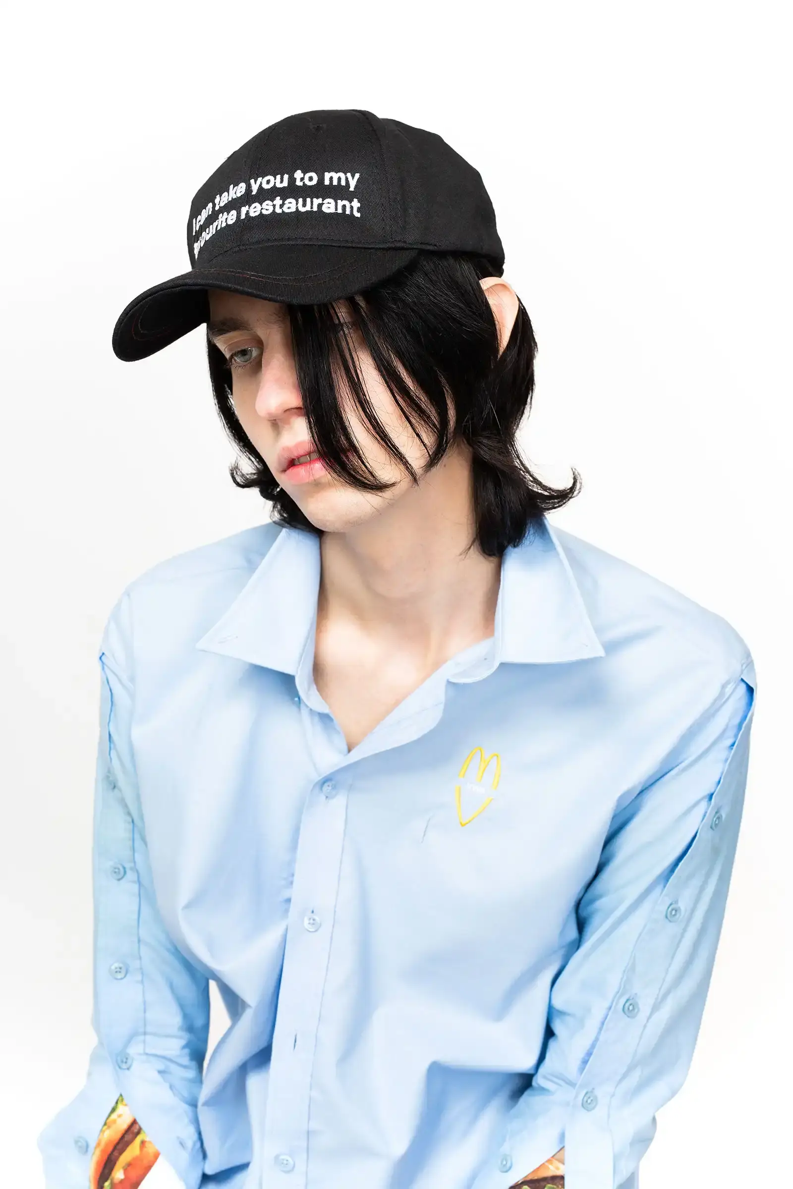 McDonald's/VAIN Close-up of streetwear pieces showing McDonald's signature gingham pattern and logo incorporated into modern fashion designs. (image 5 of 8)