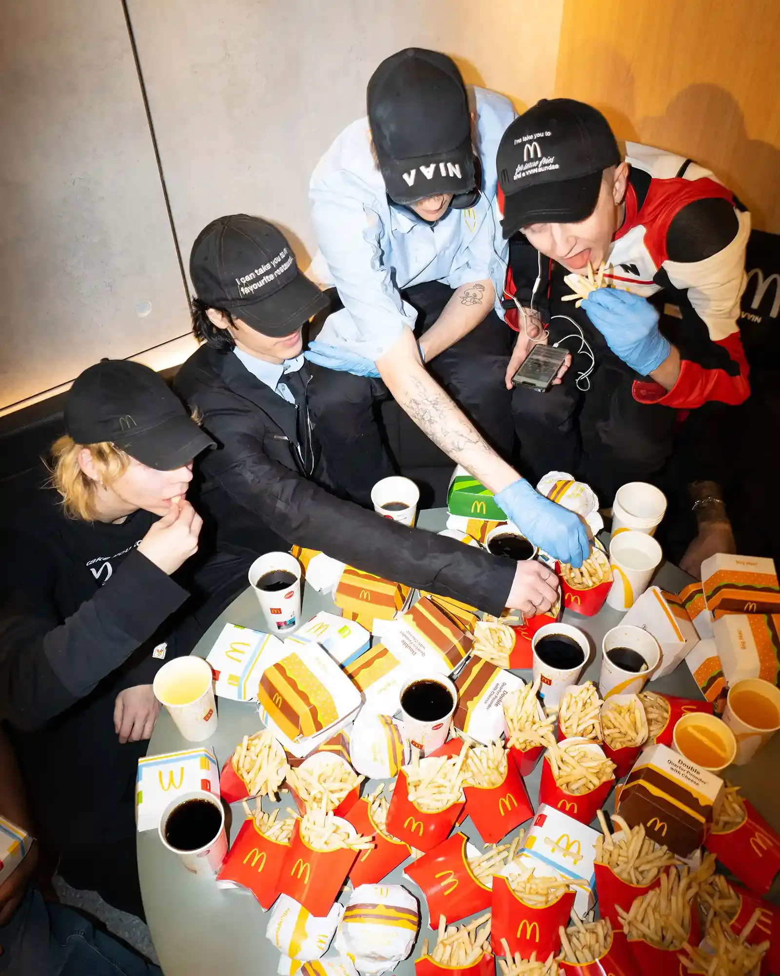 McDonald's/VAIN Close-up of streetwear pieces showing McDonald's signature gingham pattern and logo incorporated into modern fashion designs. (image 7 of 8)