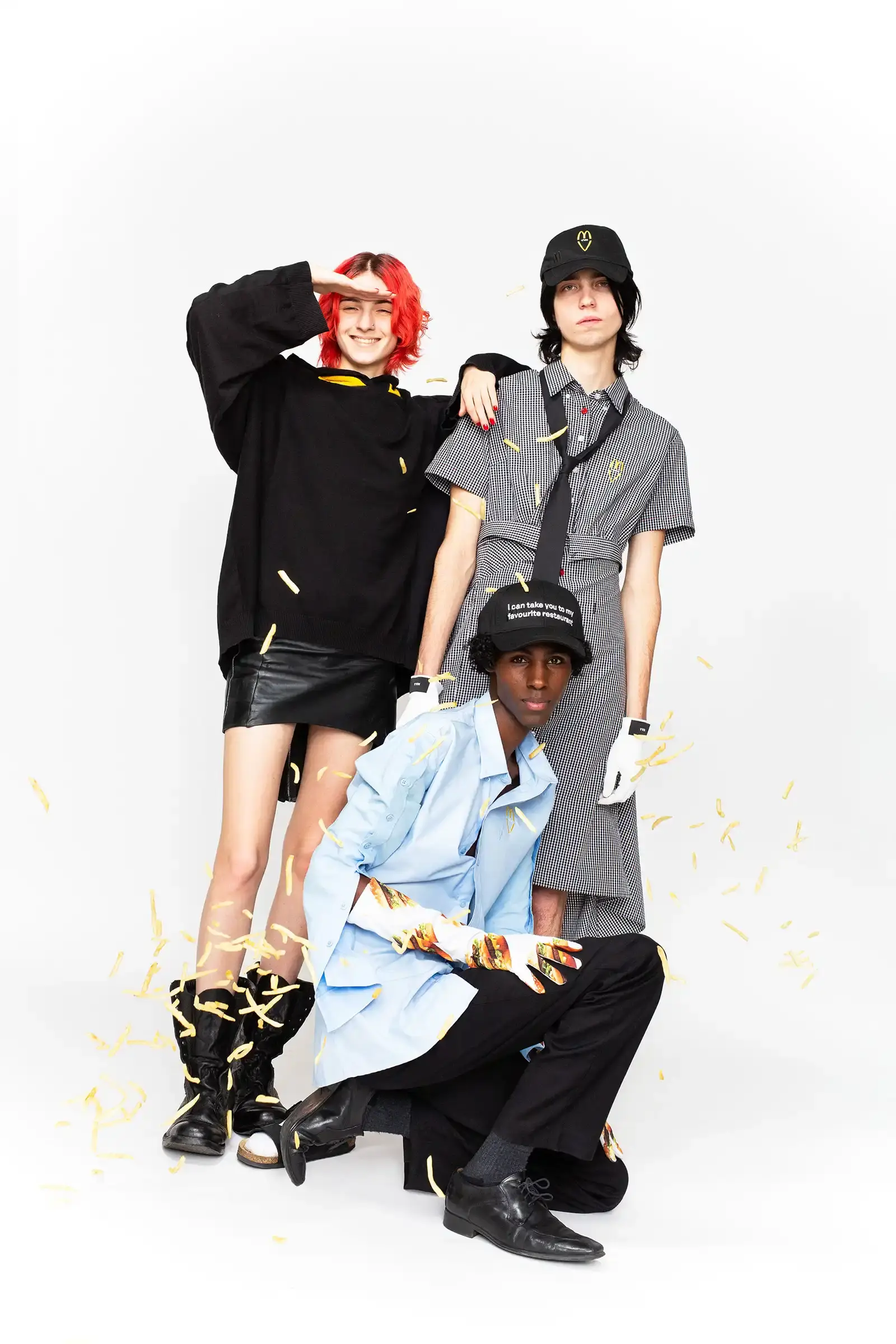 McDonald's/VAIN Close-up of streetwear pieces showing McDonald's signature gingham pattern and logo incorporated into modern fashion designs. (image 6 of 8)
