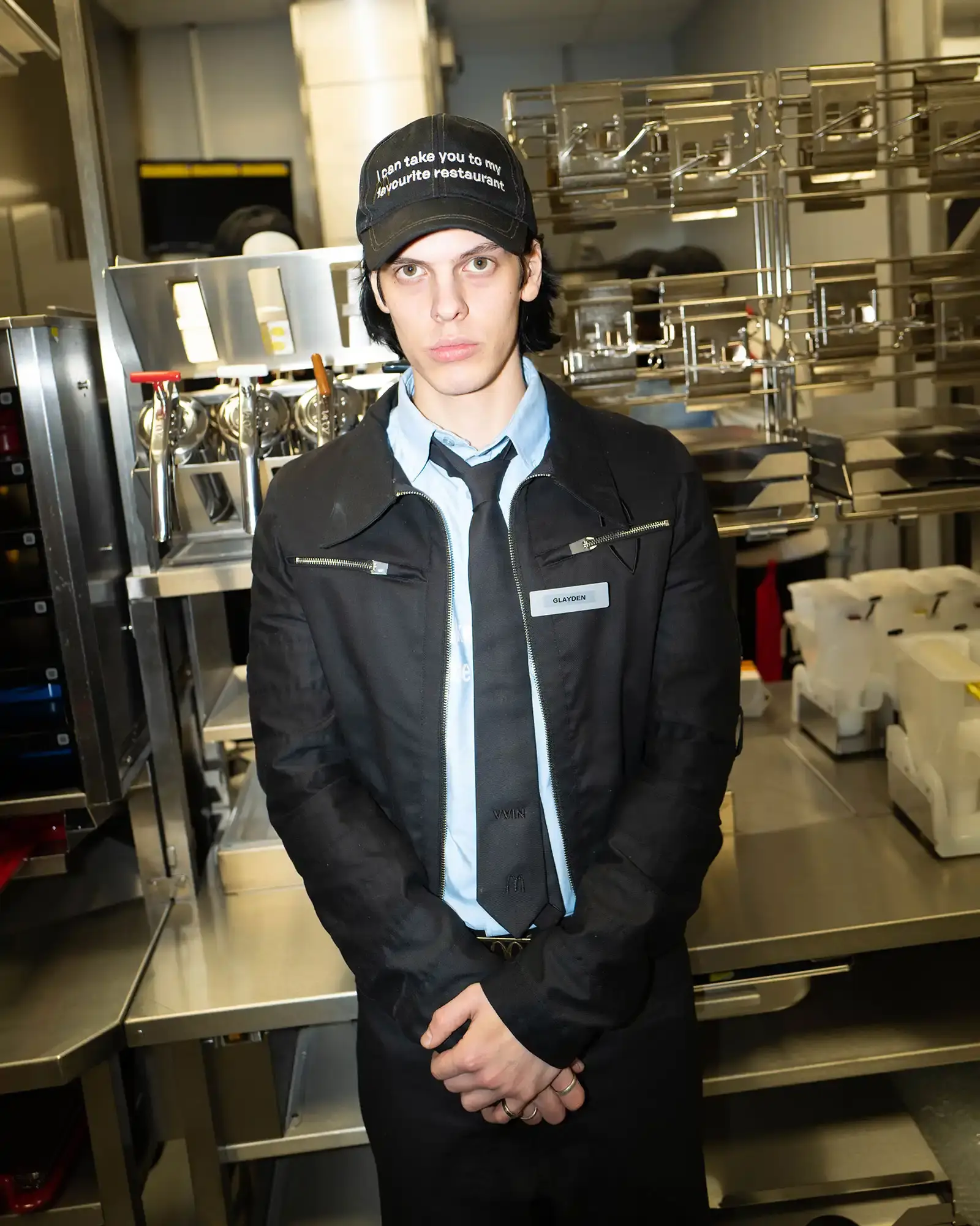 McDonald's/VAIN Close-up of streetwear pieces showing McDonald's signature gingham pattern and logo incorporated into modern fashion designs. (image 8 of 8)