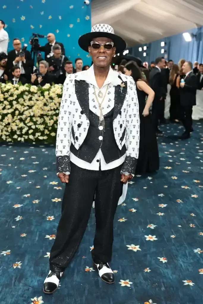 MET GALA 2025: FASHION'S ELITE INTERPRET "TAILORED FOR YOU" image of the 2025 Met Gala event celebrating the "Superfine: Tailoring Black Style" exhibition. It describes key celebrity appearances including André 3000's piano-shouldered look, pregnant Rihanna, and Teyana Taylor's Ruth E. Carter design. The article mentions prominent attendees like A$AP Rocky, Lewis Hamilton, and Zendaya, and highlights Moncler's first-time participation with custom designs for celebrities including Serena Williams and Alicia Keys. The text explains how the event's "Tailored for You" theme connected to Black dandyism and cultural identity expressed through fashion. (image 3 of 10)