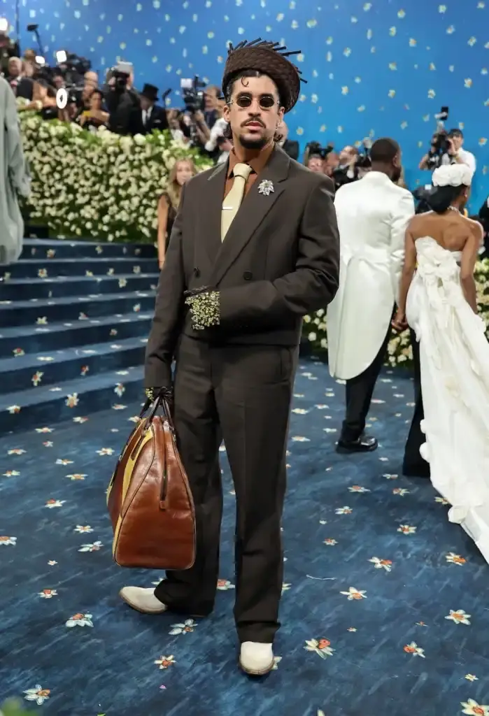 MET GALA 2025: FASHION'S ELITE INTERPRET "TAILORED FOR YOU" image of the 2025 Met Gala event celebrating the "Superfine: Tailoring Black Style" exhibition. It describes key celebrity appearances including André 3000's piano-shouldered look, pregnant Rihanna, and Teyana Taylor's Ruth E. Carter design. The article mentions prominent attendees like A$AP Rocky, Lewis Hamilton, and Zendaya, and highlights Moncler's first-time participation with custom designs for celebrities including Serena Williams and Alicia Keys. The text explains how the event's "Tailored for You" theme connected to Black dandyism and cultural identity expressed through fashion. (image 6 of 10)