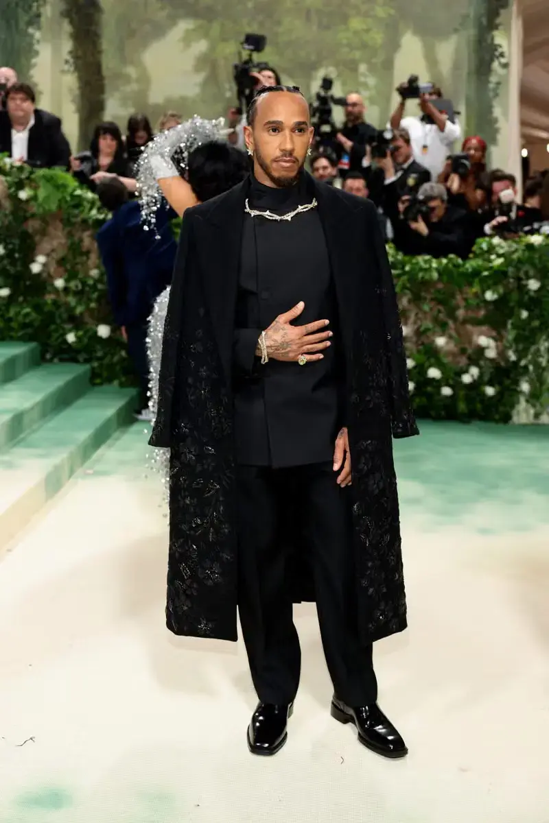 Article detailing the Met Gala 2025 exhibition 'Superfine: Tailoring Black Style,' discussing its theme, committee members including Grace Wales Bonner and Dapper Dan, and the significance of Black dandyism in fashion history.
