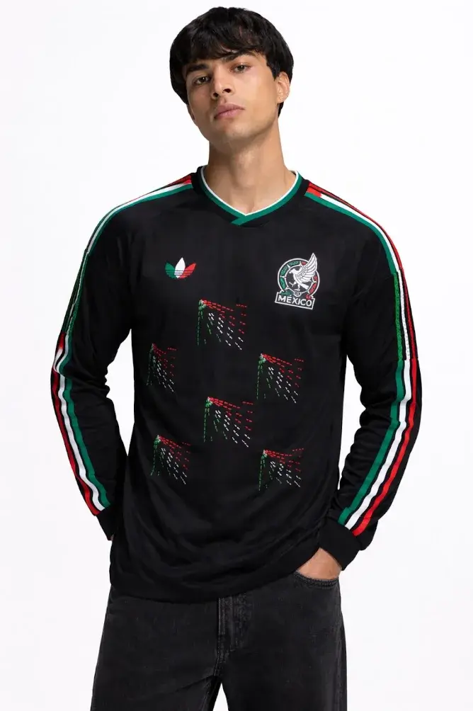 ADIDAS & SOMEONE SOMEWHERE RELEASE MEXICAN FOOTBALL JERSEY This image outlines the release of a limited edition adidas and Someone Somewhere Mexican football jersey. The jersey features hand embroidery by Indigenous artisans. (image 9 of 10)