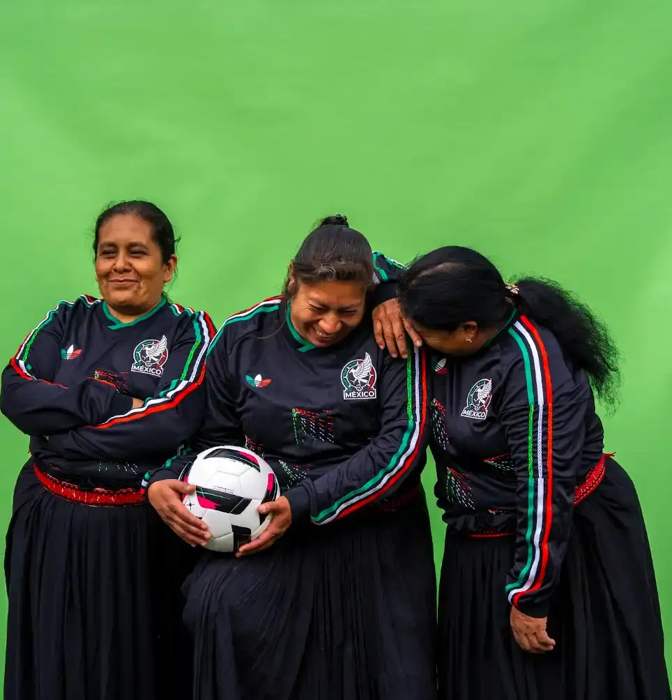 ADIDAS & SOMEONE SOMEWHERE RELEASE MEXICAN FOOTBALL JERSEY This image outlines the release of a limited edition adidas and Someone Somewhere Mexican football jersey. The jersey features hand embroidery by Indigenous artisans. (image 2 of 10)