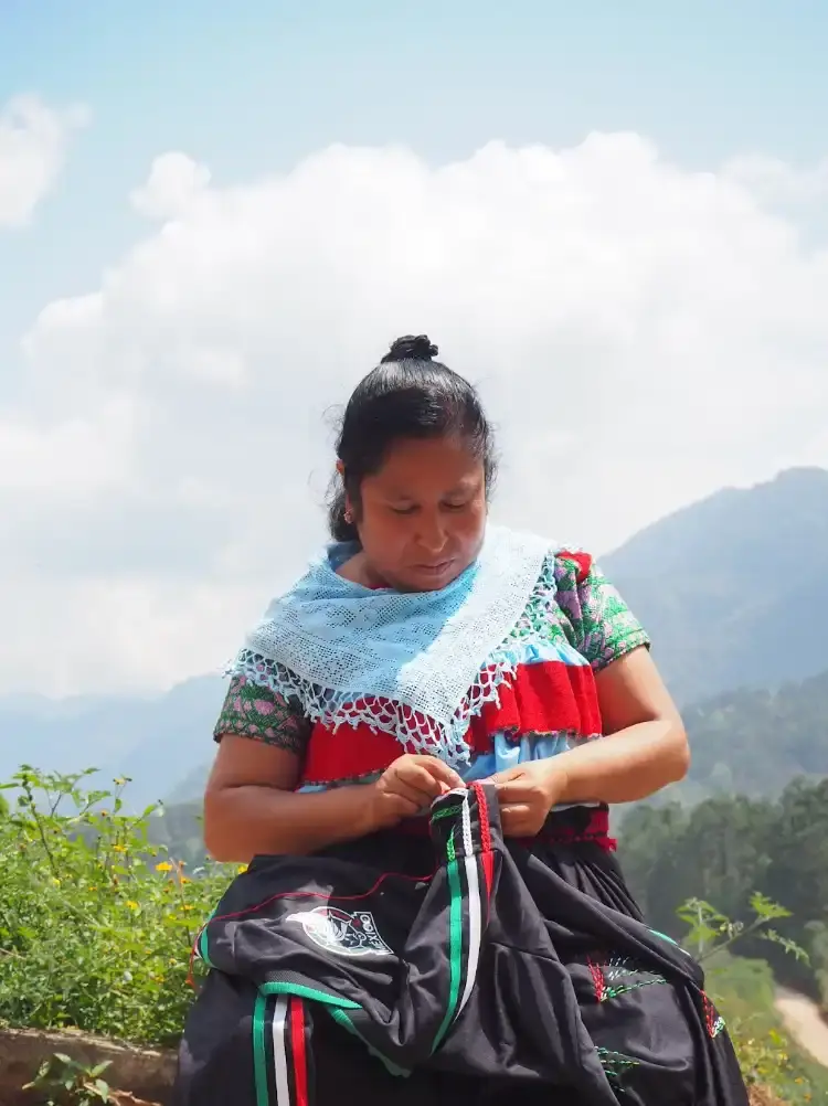 ADIDAS & SOMEONE SOMEWHERE RELEASE MEXICAN FOOTBALL JERSEY This image outlines the release of a limited edition adidas and Someone Somewhere Mexican football jersey. The jersey features hand embroidery by Indigenous artisans. (image 5 of 10)