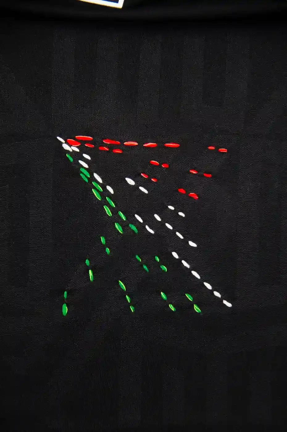 ADIDAS & SOMEONE SOMEWHERE RELEASE MEXICAN FOOTBALL JERSEY This image outlines the release of a limited edition adidas and Someone Somewhere Mexican football jersey. The jersey features hand embroidery by Indigenous artisans. (image 10 of 10)