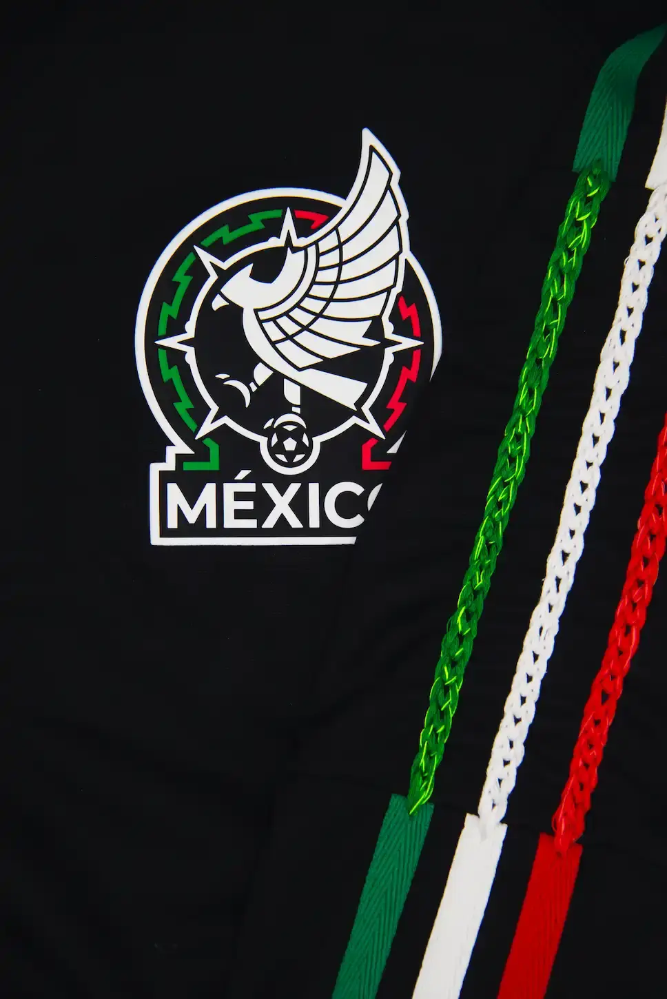 ADIDAS & SOMEONE SOMEWHERE RELEASE MEXICAN FOOTBALL JERSEY This image outlines the release of a limited edition adidas and Someone Somewhere Mexican football jersey. The jersey features hand embroidery by Indigenous artisans. (image 8 of 10)
