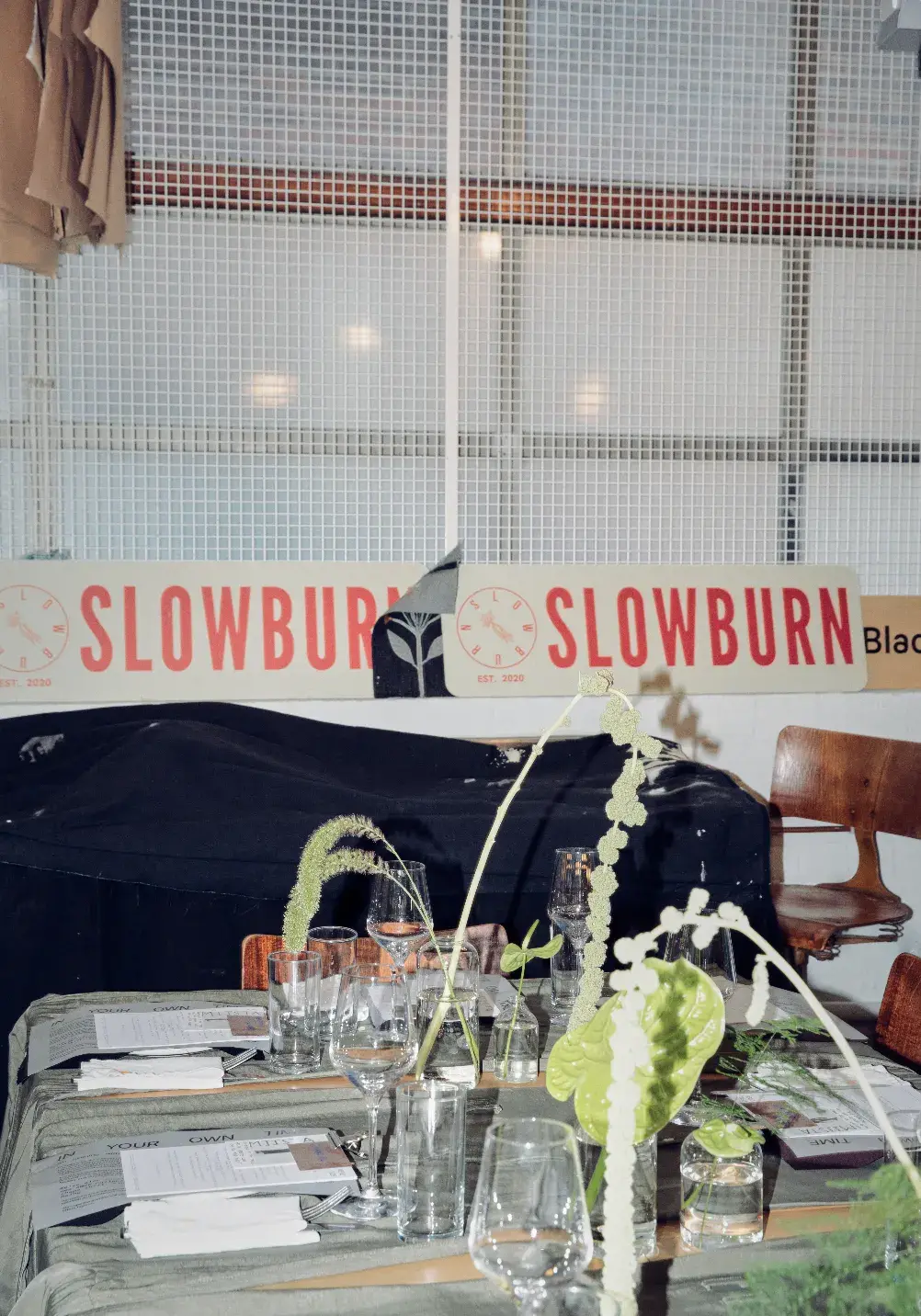 MIISTA HOSTS AW26 EVENT AT SLOWBURN LONDON An image showing Miista's AW26 dinner event at SlowBurn in East London, detailing the multi-functional garments, food presentation, and performance art. (image 17 of 19)