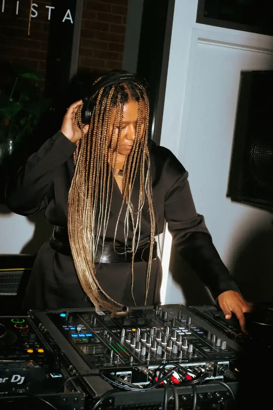 MIISTA SS26 COMBINES TECHNO MUSIC AND GARMENT MENDING An image about on the Miista Spring/Summer 2026 launch in Los Angeles. The text details the music performances and the live garment mending station at The Evans Group factory. (image 2 of 10)