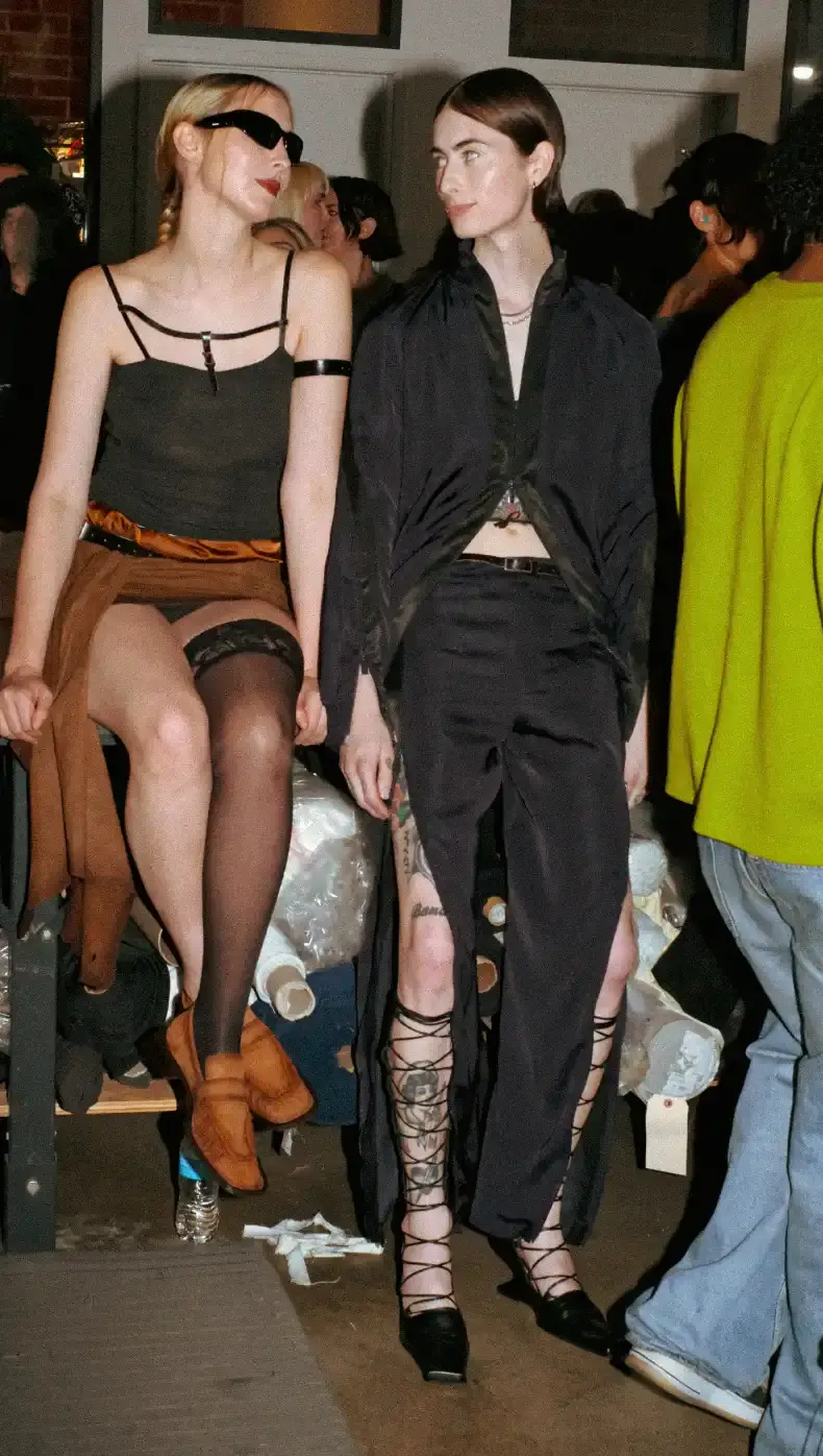 MIISTA SS26 COMBINES TECHNO MUSIC AND GARMENT MENDING An image about on the Miista Spring/Summer 2026 launch in Los Angeles. The text details the music performances and the live garment mending station at The Evans Group factory. (image 7 of 10)