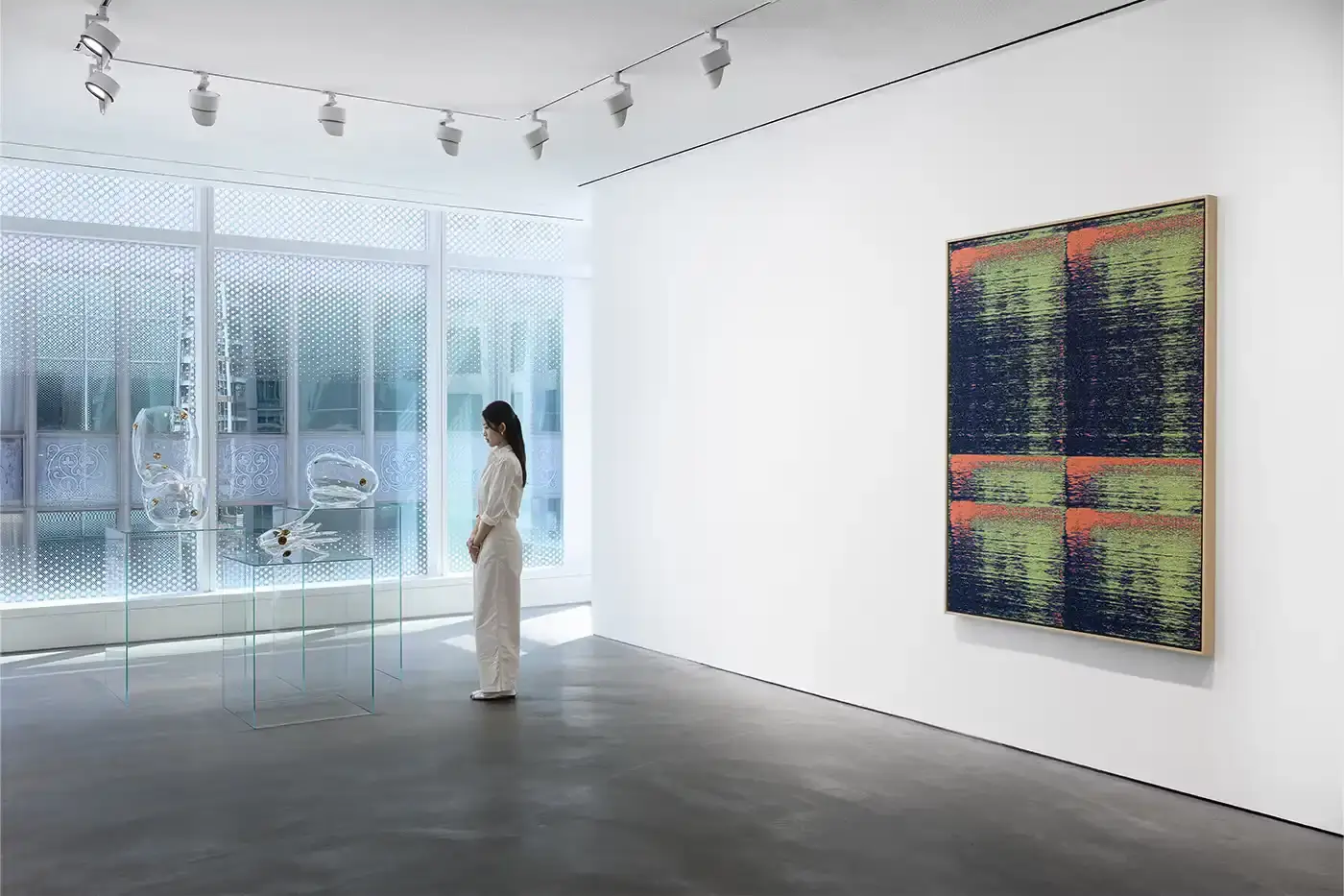 Courtesy Of The Artist and Pace Hong Kong A gallery installation view featuring Mika Tajima's multidisciplinary artwork. Translucent acrylic paintings with gradient pigments, textile spectrograms of brain wave data, and rose quartz and glass sculptures that investigate technological mediation of human experience. (image 8 of 9)