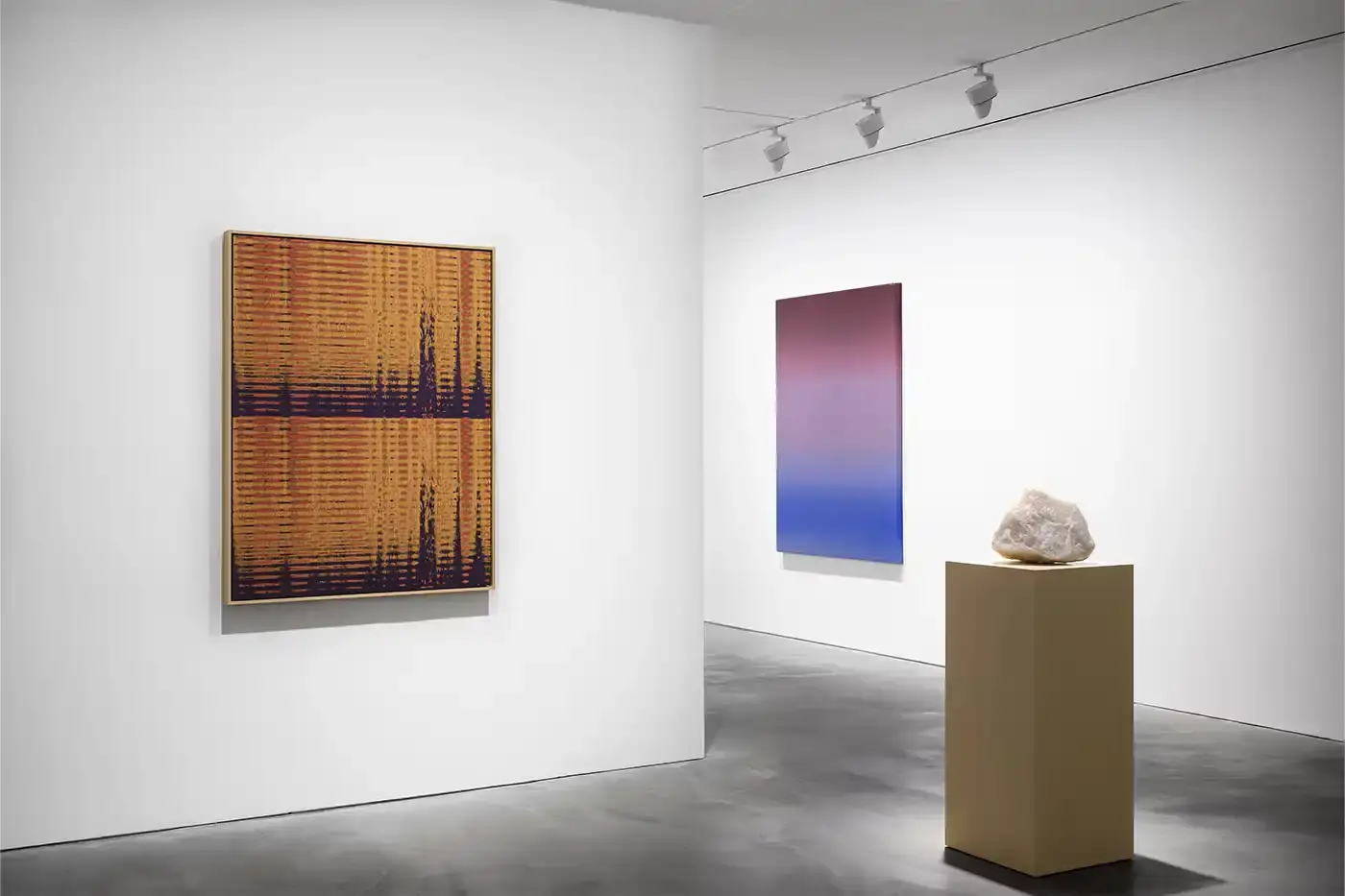 Courtesy Of The Artist and Pace Hong Kong A gallery installation view featuring Mika Tajima's multidisciplinary artwork. Translucent acrylic paintings with gradient pigments, textile spectrograms of brain wave data, and rose quartz and glass sculptures that investigate technological mediation of human experience. (image 3 of 9)