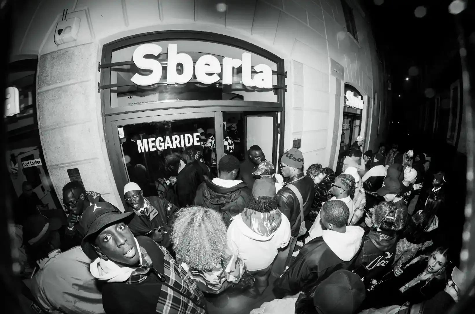 This article describes how FOR THE CULTURE, a Milan-based collective of second-generation Italians, has grown from a print magazine to an influential urban culture platform. It details their recent partnership with Foot Locker to launch the Adidas Megaride sneaker, highlighting how the collective provides authentic representation and creates opportunities for immigrant youth in Italy's creative industries. The article explains their mission to build networks among artists, entrepreneurs, and storytellers who are reshaping Italy's cultural landscape.