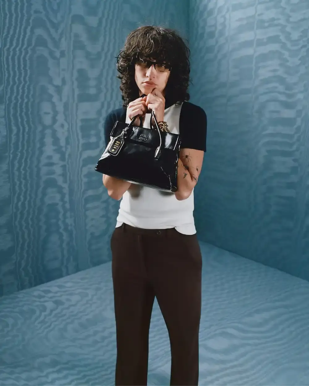 MIU MIU FEATURES KYLIE JENNER IN FALL 2025 CAMPAIGN image about Miu Miu's latest advertising campaign featuring seven diverse women including Kylie Jenner, exploring gender-neutral fashion design through pastel colors and fluid silhouettes for the fall/winter 2025 collection. (image 5 of 6)