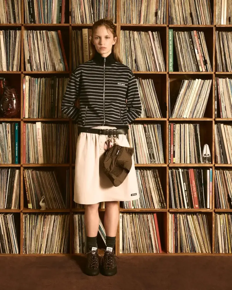 MIU MIU OPENS VINYL CLUB POP-UP SPACES image detailing Miu Miu's Vinyl Club pop-up project, featuring fashion items, custom audio gear, and global location dates. (image 11 of 11)