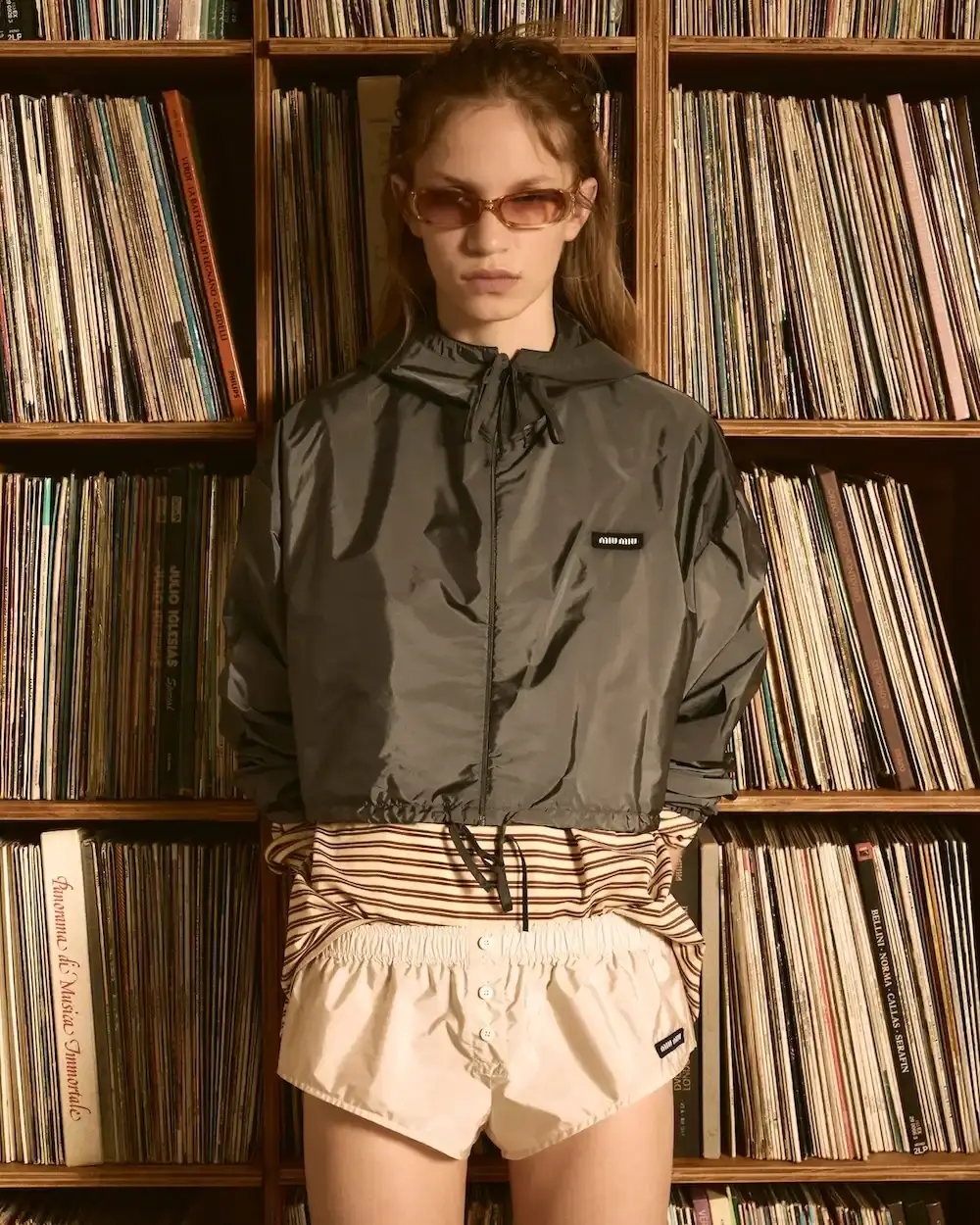 MIU MIU OPENS VINYL CLUB POP-UP SPACES image detailing Miu Miu's Vinyl Club pop-up project, featuring fashion items, custom audio gear, and global location dates. (image 6 of 11)