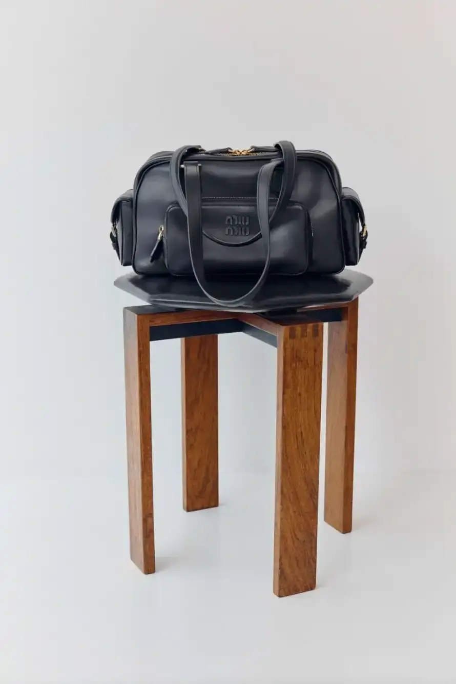 MIU MIU REVIVES ITS MULTI-POCKET DESIGN image about Miu Miu's expanded Pocket Bag collection, detailing the various styles, materials, and design features of bags characterized by functional exterior pockets originally introduced in the brand's Spring/Summer 2023 runway show. (image 1 of 2)