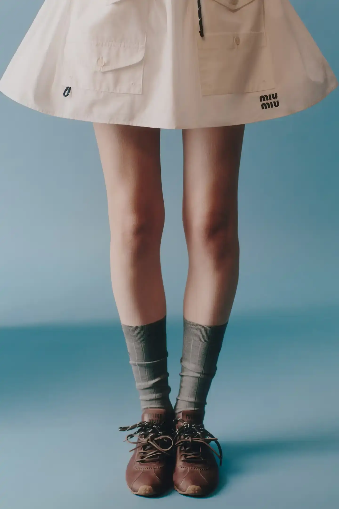 MIU MIU OPENS 2026 WITH PRELUDE COLLECTION Miu Miu introduces Prelude collection for 2026, featuring workwear-inspired pieces, two new sneaker models with customization options, and a range of bags and ready-to-wear items. (image 6 of 11)
