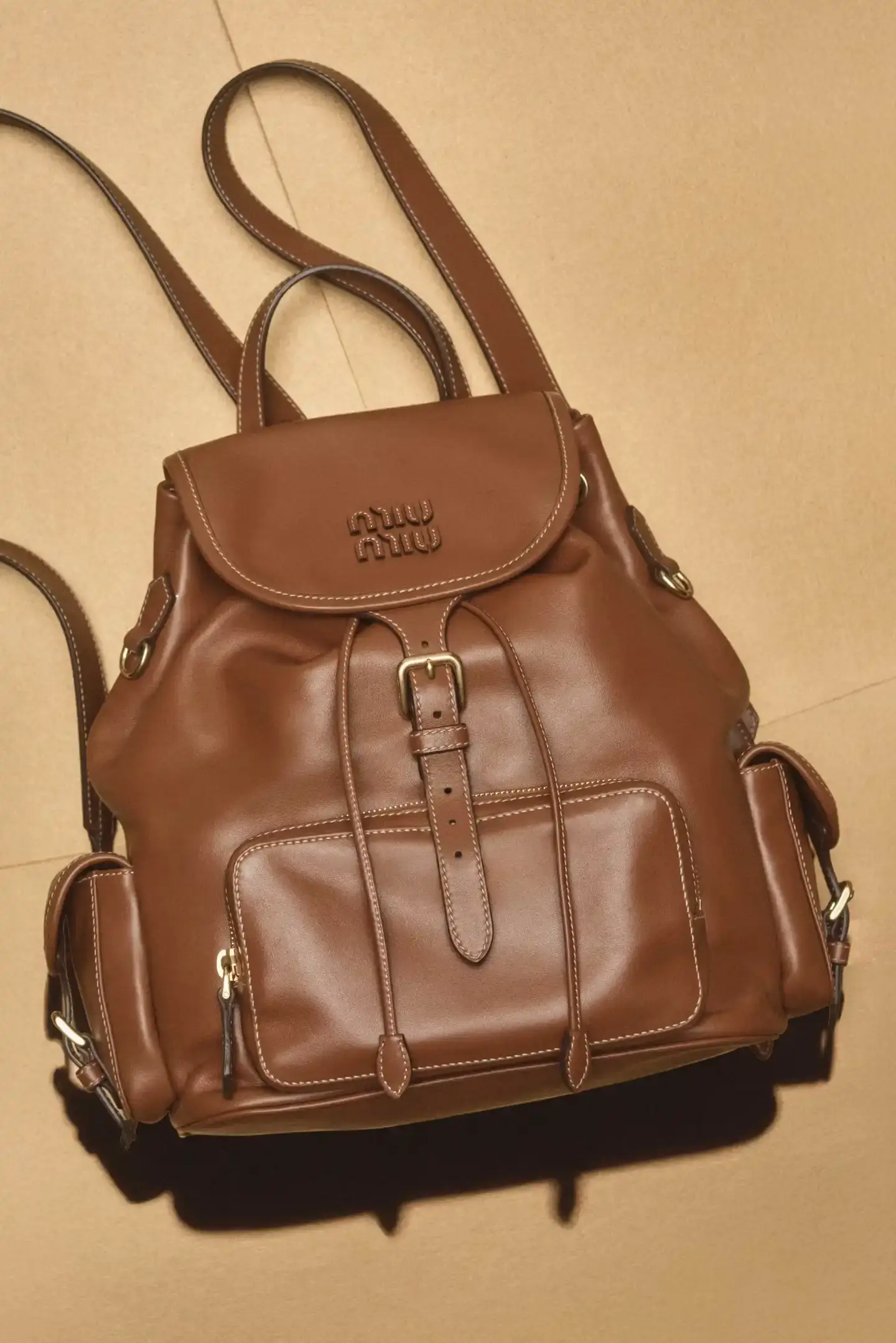 MIU MIU OPENS 2026 WITH PRELUDE COLLECTION Miu Miu introduces Prelude collection for 2026, featuring workwear-inspired pieces, two new sneaker models with customization options, and a range of bags and ready-to-wear items. (image 7 of 10)