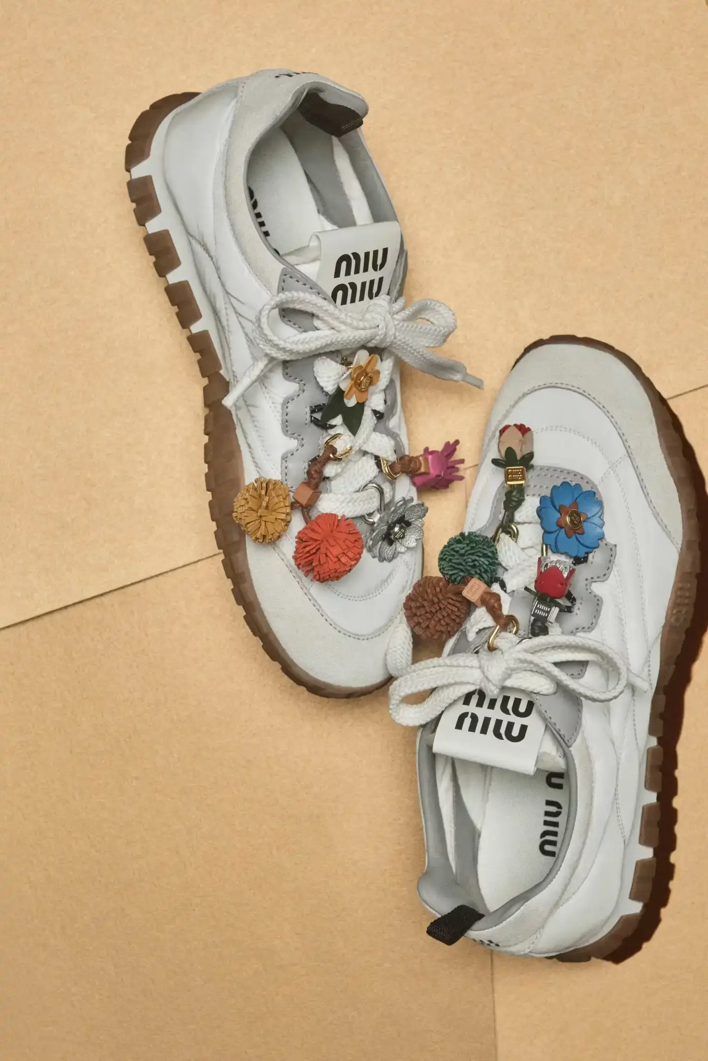 MIU MIU OPENS 2026 WITH PRELUDE COLLECTION Miu Miu introduces Prelude collection for 2026, featuring workwear-inspired pieces, two new sneaker models with customization options, and a range of bags and ready-to-wear items. (image 4 of 10)