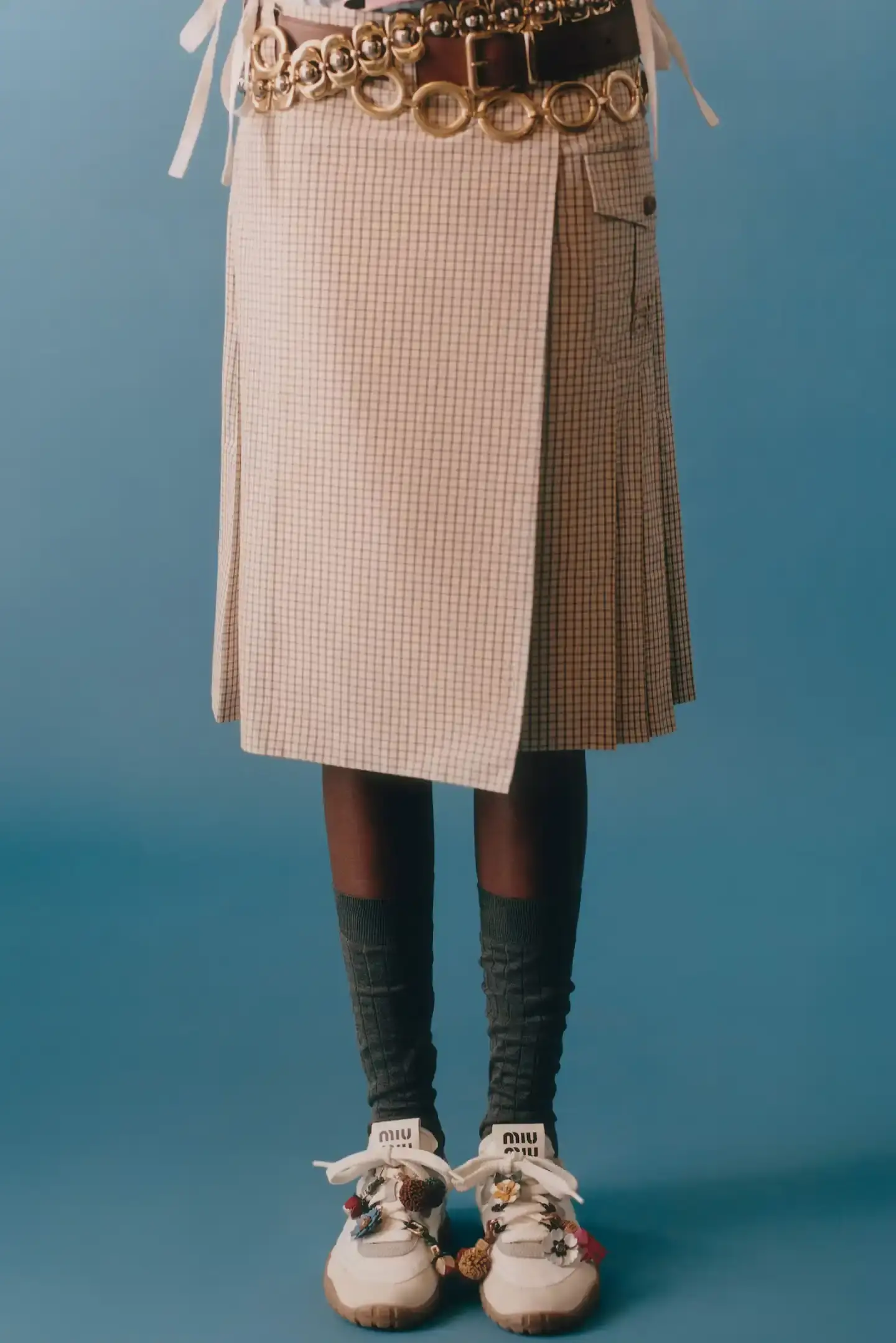 MIU MIU OPENS 2026 WITH PRELUDE COLLECTION Miu Miu introduces Prelude collection for 2026, featuring workwear-inspired pieces, two new sneaker models with customization options, and a range of bags and ready-to-wear items. (image 3 of 11)