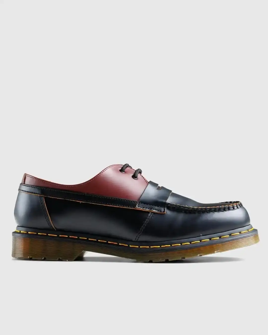 ollection display of MM6 Maison Margiela x Dr. Martens hybrid shoes, showing various angles of the merged boot and shoe designs
