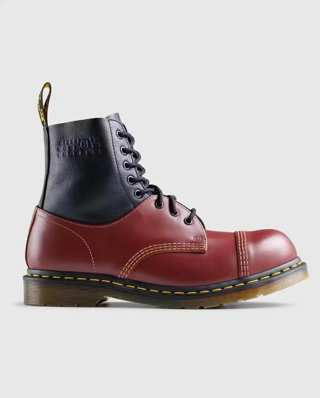 Hybrid leather shoe combining loafer and three-eyelet Oxford designs, with Dr. Martens' characteristic sole and stitching