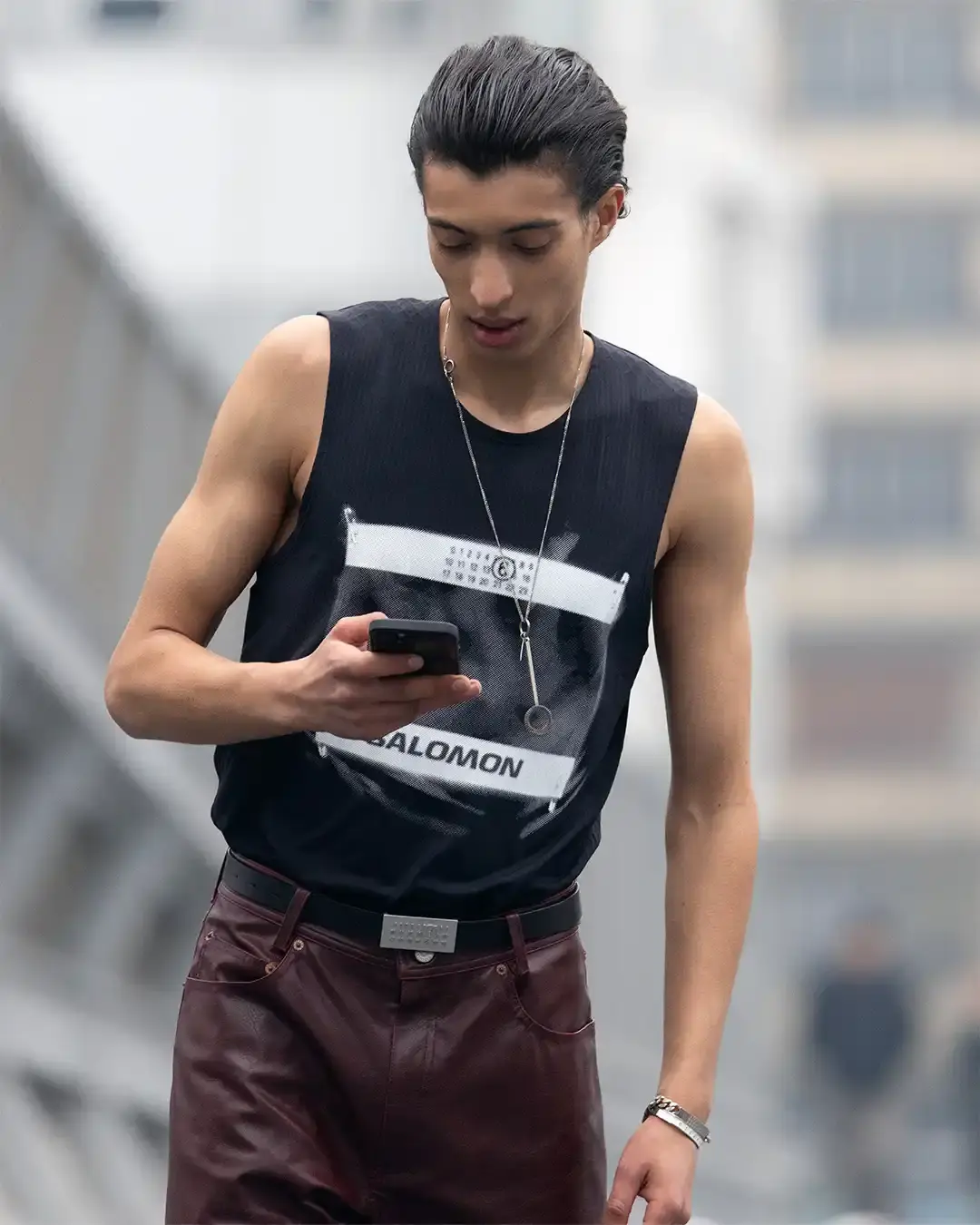 MM6 MAISON MARGIELA AND SALOMON DEBUT NEW JOINT COLLECTION FOR SPRING/SUMMER 2025 photo of the Spring/Summer 2025 collaboration between fashion brand MM6 Maison Margiela and athletic brand Salomon. It describes their unisex collection that combines experimental design with technical sportswear functionality. The collection includes running-inspired garments with technical materials and distinctive proportions, plus footwear like the Spectur 2 running shoe in black and sage green, and new colorways of the XT-4 Mule. The collection will be released in two drops on April 17 and May 8, available through both brands' websites and select retailers.