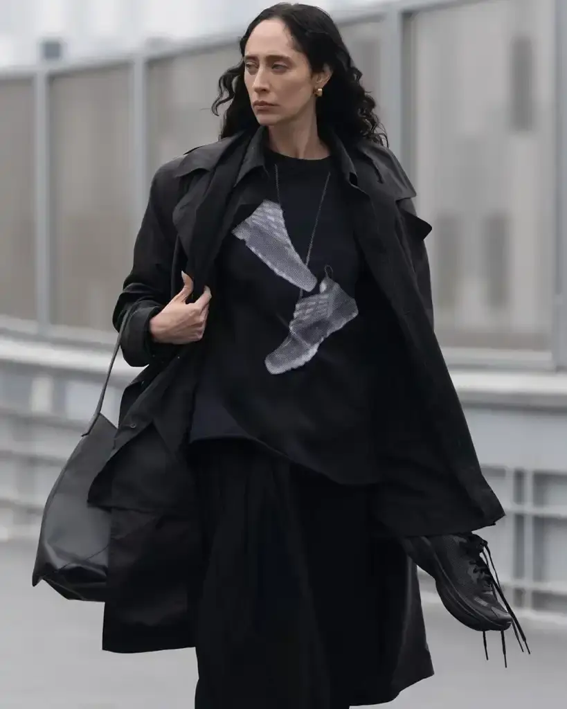 MM6 MAISON MARGIELA AND SALOMON DEBUT NEW JOINT COLLECTION FOR SPRING/SUMMER 2025 photo of the Spring/Summer 2025 collaboration between fashion brand MM6 Maison Margiela and athletic brand Salomon. It describes their unisex collection that combines experimental design with technical sportswear functionality. The collection includes running-inspired garments with technical materials and distinctive proportions, plus footwear like the Spectur 2 running shoe in black and sage green, and new colorways of the XT-4 Mule. The collection will be released in two drops on April 17 and May 8, available through both brands' websites and select retailers. (image 7 of 7)