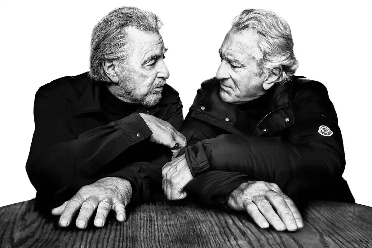 MONCLER AD CAMPAIGN REUNITES DE NIRO AND PACINO Black and white portraits of actors Al Pacino and Robert De Niro wearing Moncler outerwear for the Warmer Together campaign. (image 3 of 9)