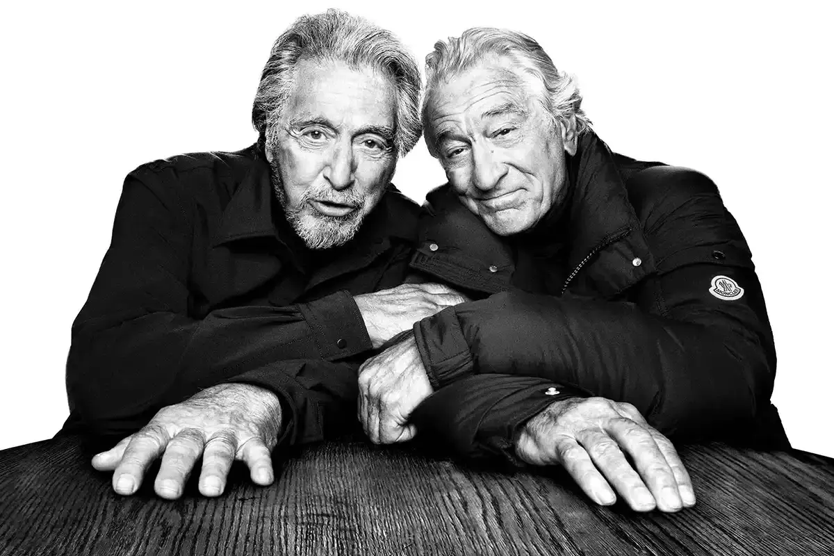 MONCLER AD CAMPAIGN REUNITES DE NIRO AND PACINO Black and white portraits of actors Al Pacino and Robert De Niro wearing Moncler outerwear for the Warmer Together campaign. (image 2 of 9)
