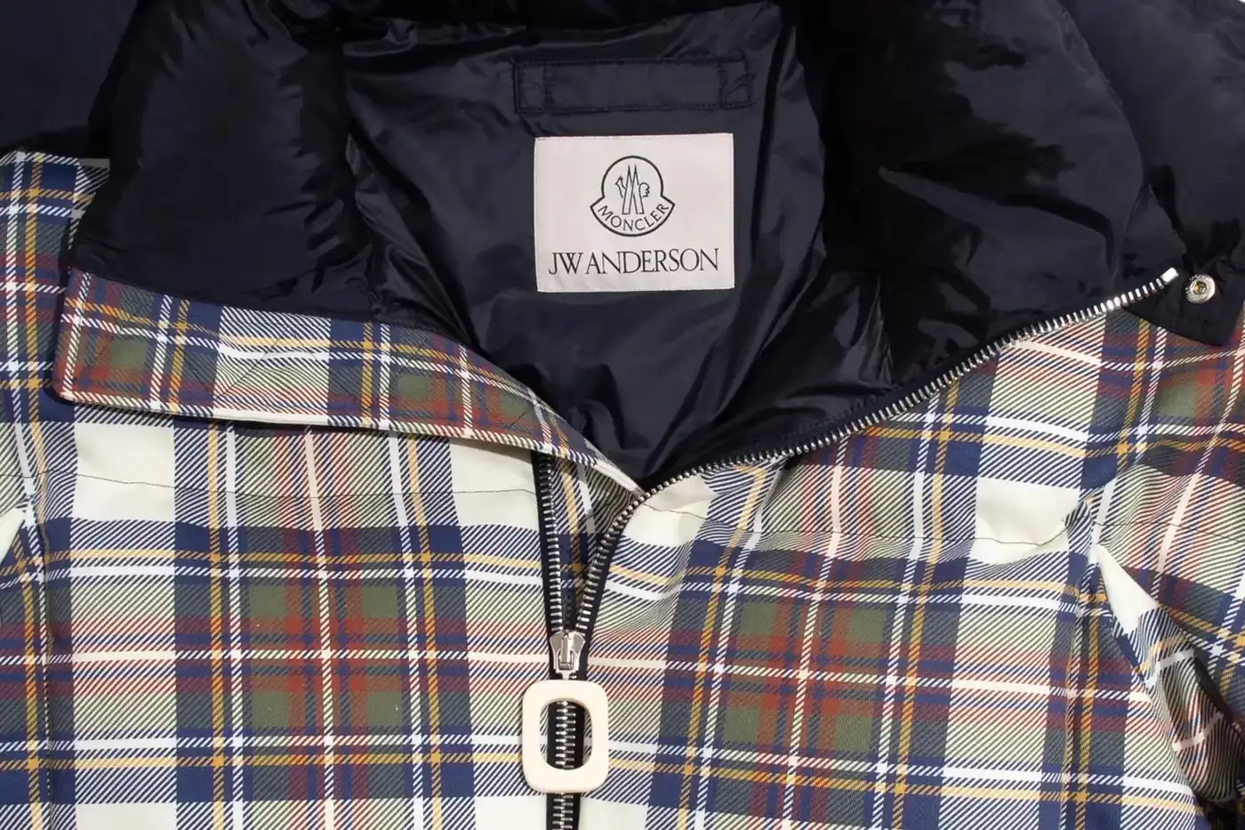 MONCLER AND JW ANDERSON LAUNCH LIMITED PUFFER COLLECTION Moncler collaborates with JW Anderson on a limited collection featuring two down-filled puffer jackets with archive-inspired designs, priced at $2,890 USD each. (image 3 of 8)