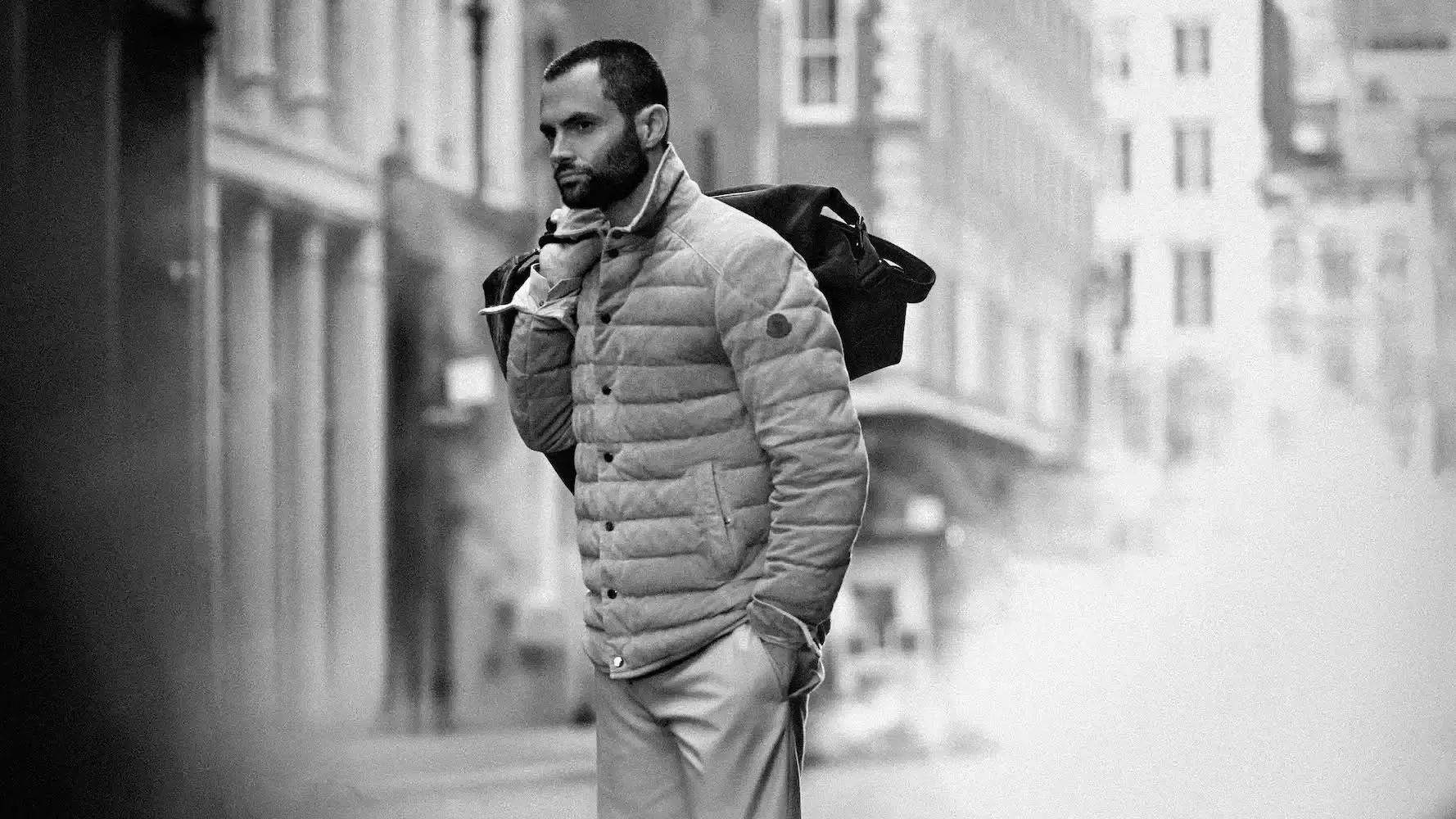 Moncler Urban street style photograph of Penn Badgley in Moncler's grey outerwear collection