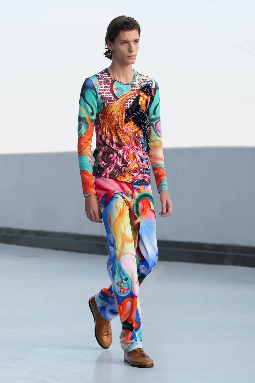 MOSCHINO SS27: MESSINA AND RIZZO DEBUT IN MILAN image of Moschino runway show at Milan Fashion Week, detailing the archival approach of creative director Adrian Appiolaza and brand history under Aeffe Group. (image 5 of 14)