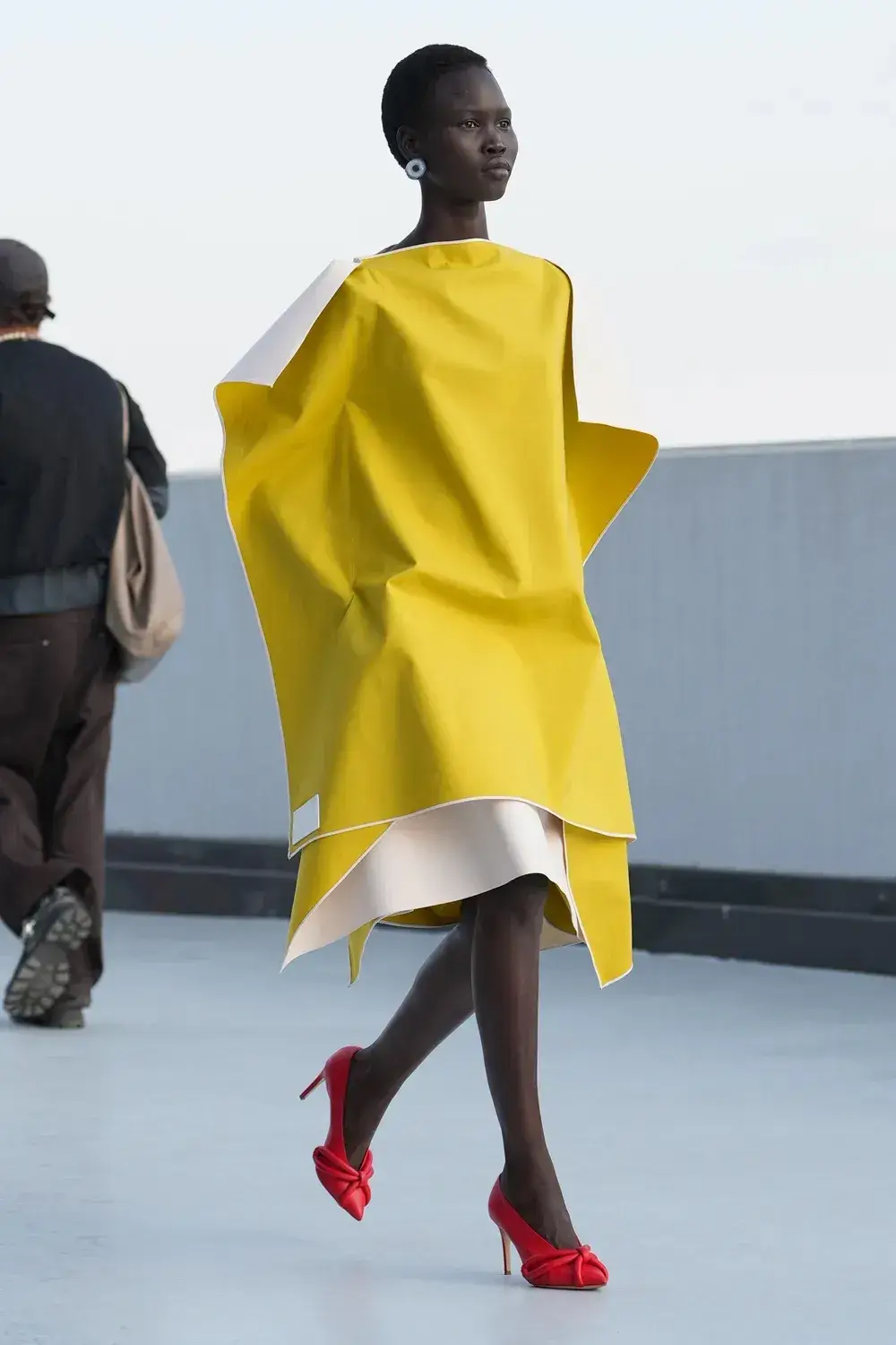 MOSCHINO SS27: MESSINA AND RIZZO DEBUT IN MILAN image of Moschino runway show at Milan Fashion Week, detailing the archival approach of creative director Adrian Appiolaza and brand history under Aeffe Group. (image 3 of 14)