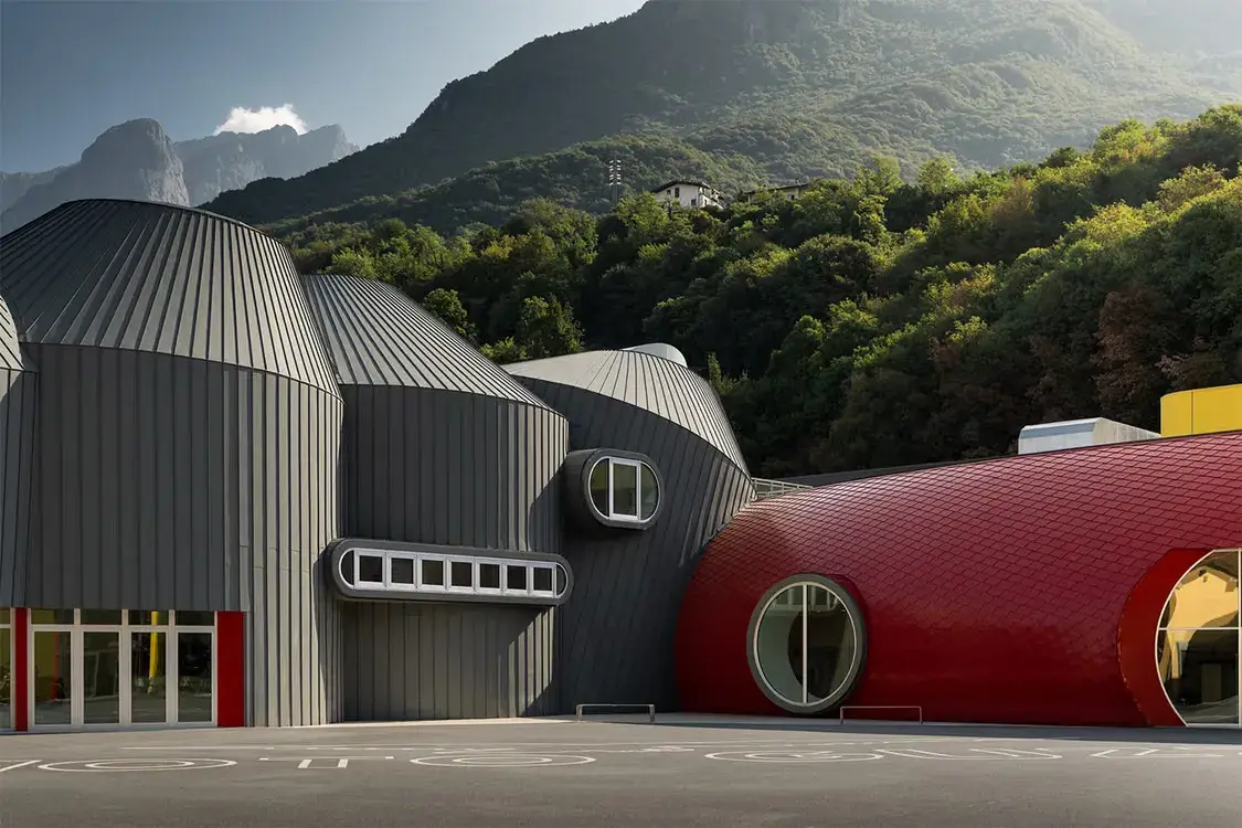 MOTO GUZZI OPENS GREG LYNN MUSEUM IN MANDELLO image of the opening of the new Moto Guzzi factory and museum in Mandello del Lario. The article details the architectural design by Greg Lynn and the features of the new facility.