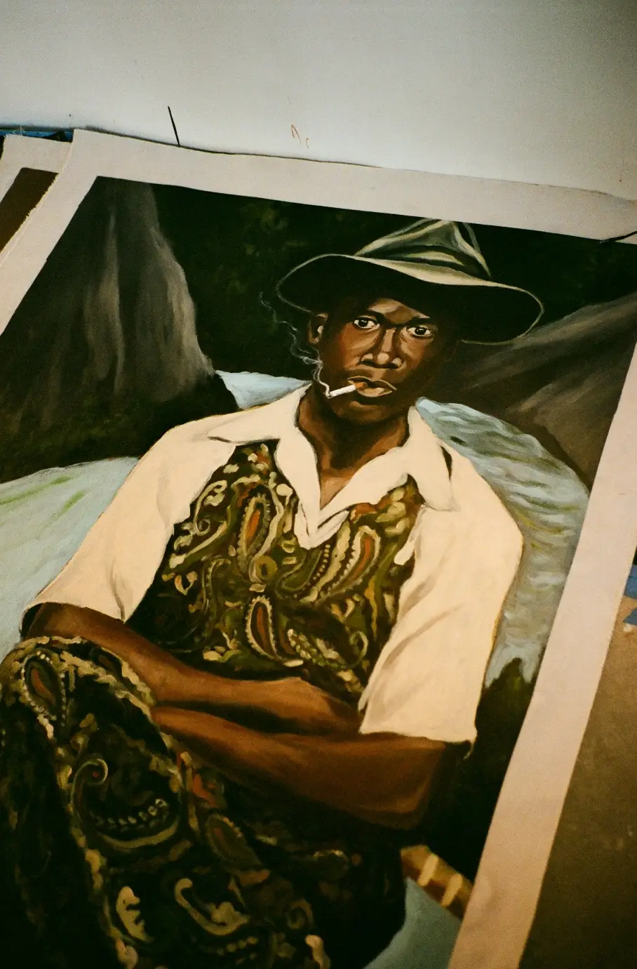 MR STAR CITY ON TURNING PERSONAL EXPERIENCE INTO POWERFUL ART image of the artist Mr Star City. He discusses his painting series, personal loss, family relationships, and artistic process. (image 2 of 5)