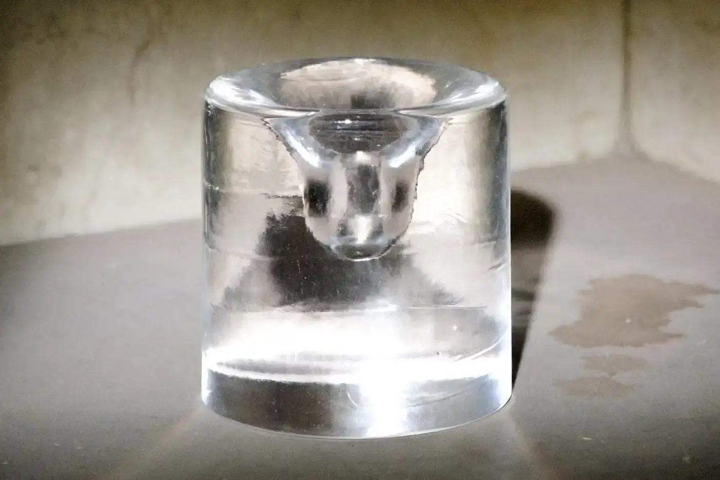 6:AM Glassworks Clear crystal Palo Santo holder by 6:AM Glassworks, showing circular cavity in 8cm glass form.