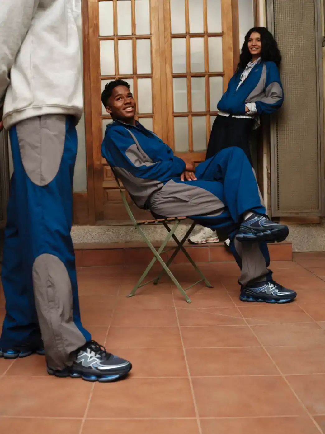 ENDRICK STARS IN NEW BALANCE ABZORB 2000 CAMPAIGN The header image displays Endrick standing on a street corner in Madrid while holding a grey and blue New Balance ABZORB 2000 sneaker. He wears a blue athletic tracksuit and looks down at the shoe in his hands. (image 2 of 4)
