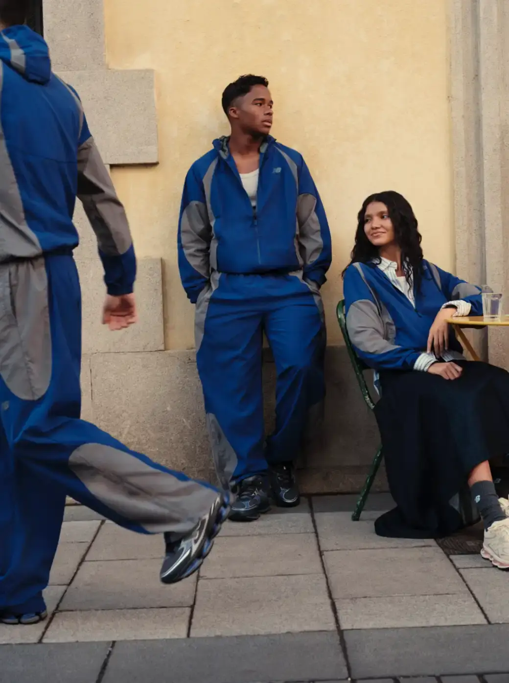 ENDRICK STARS IN NEW BALANCE ABZORB 2000 CAMPAIGN The header image displays Endrick standing on a street corner in Madrid while holding a grey and blue New Balance ABZORB 2000 sneaker. He wears a blue athletic tracksuit and looks down at the shoe in his hands. (image 3 of 4)