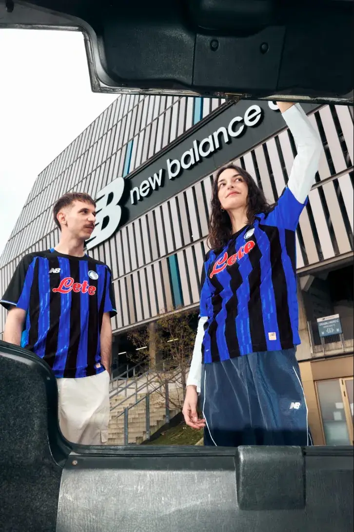 NEW BALANCE REVEALS ATALANTA BC 2026/27 KIT An image of the new Atalanta BC home jersey for the 2026/27 season, featuring Oasis Blue and black vertical stripes with metallic accents. (image 2 of 4)