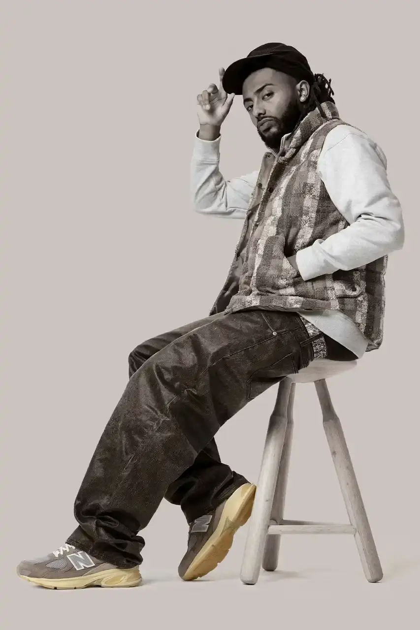 THE RETURN OF GRAY DAYS: NEW BALANCE'S ANNUAL MAY CELEBRATION image of the New Balance's annual Gray Days celebration happening throughout May 2025. It details the complete release schedule of gray-colored sneakers and apparel, beginning with multiple models launching on May 1st including the MT10, 740, and 9060. It mentions that brand representatives Aminé and Cameron Brink appear in the promotional lookbook. The article provides specific release dates for notable models like the 1906L sneaker loafer (May 14th), the ABZORB 2010 and 471 silhouettes (May 22nd), Andrew Reynolds' Numeric 933 (May 26th), and the 1300JP (May 29th). Products will be available through New Balance and select retailers, priced between $40 and $330. (image 8 of 10)