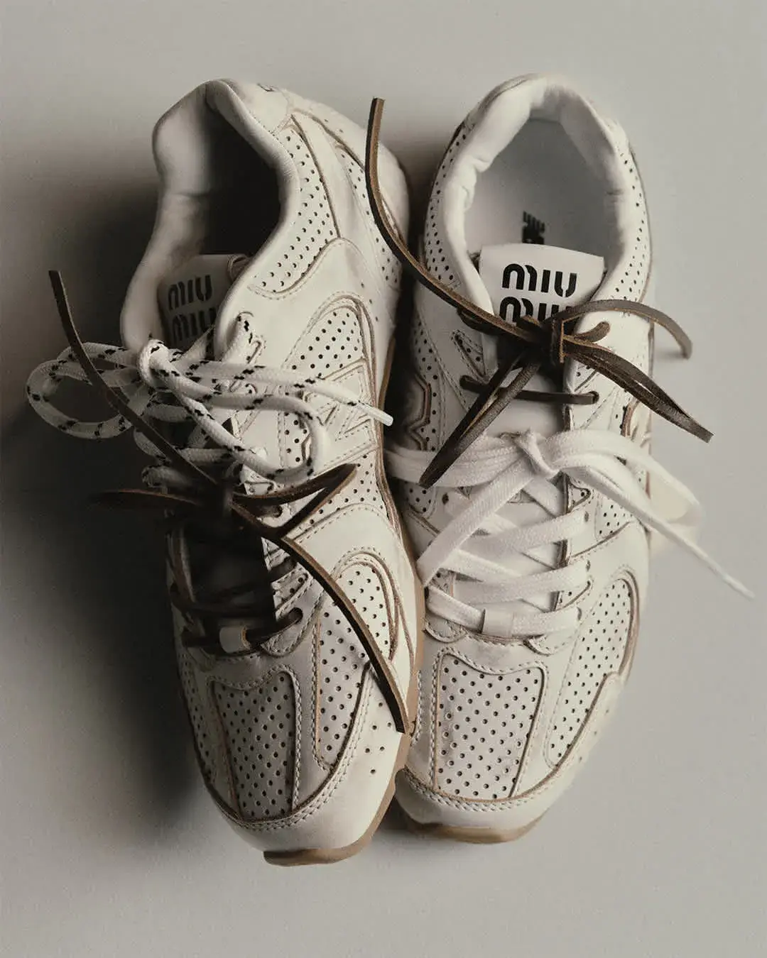 NEW BALANCE AND MIU MIU LAUNCH COCO GAUFF LINE image detailing the performance tennis clothing collaboration between New Balance and Miu Miu worn by athlete Coco Gauff. (image 2 of 12)